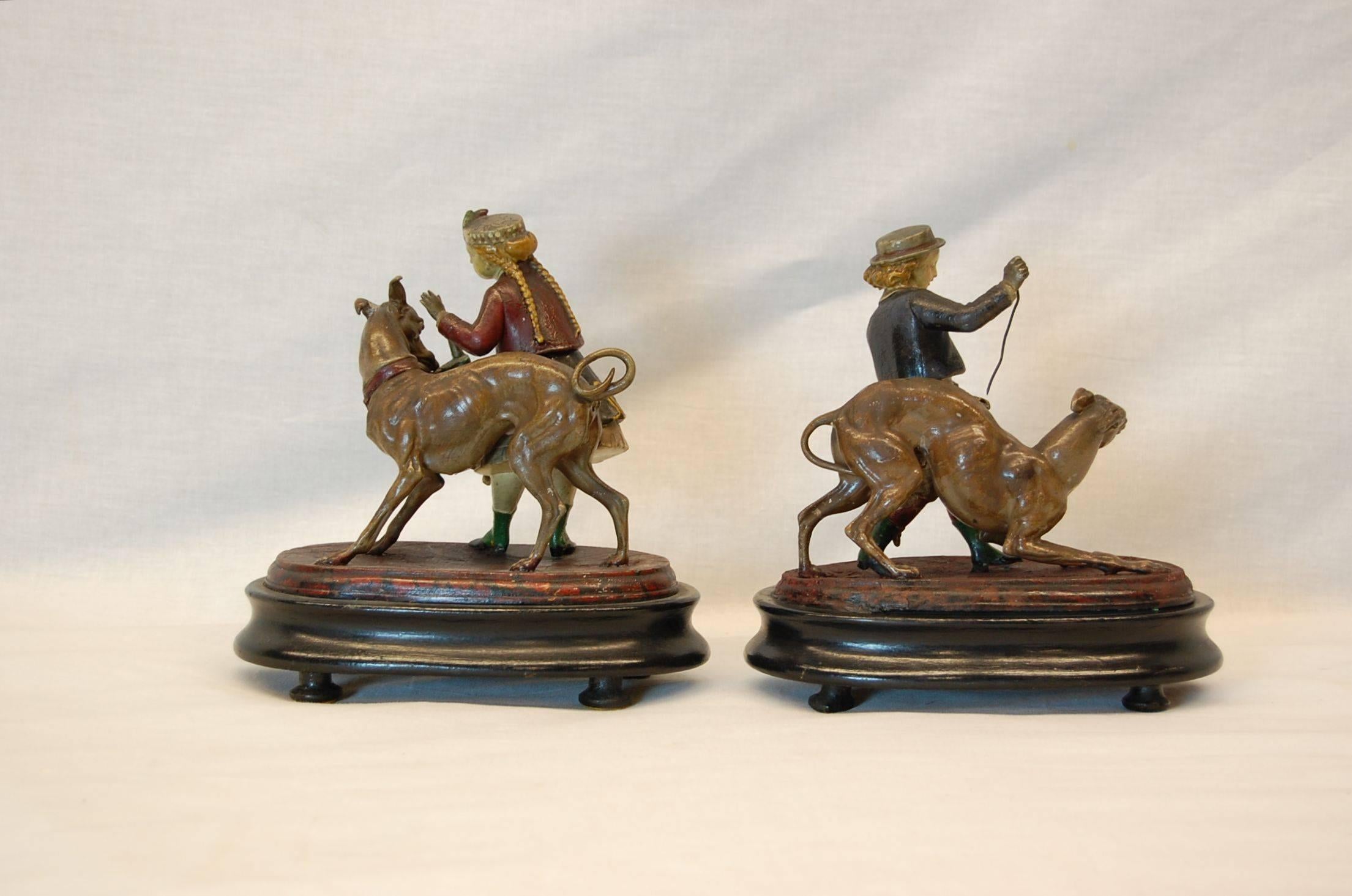 Hand-Painted Pair of Metal Figurines Featuring Children and Their Dogs, circa 1890 For Sale