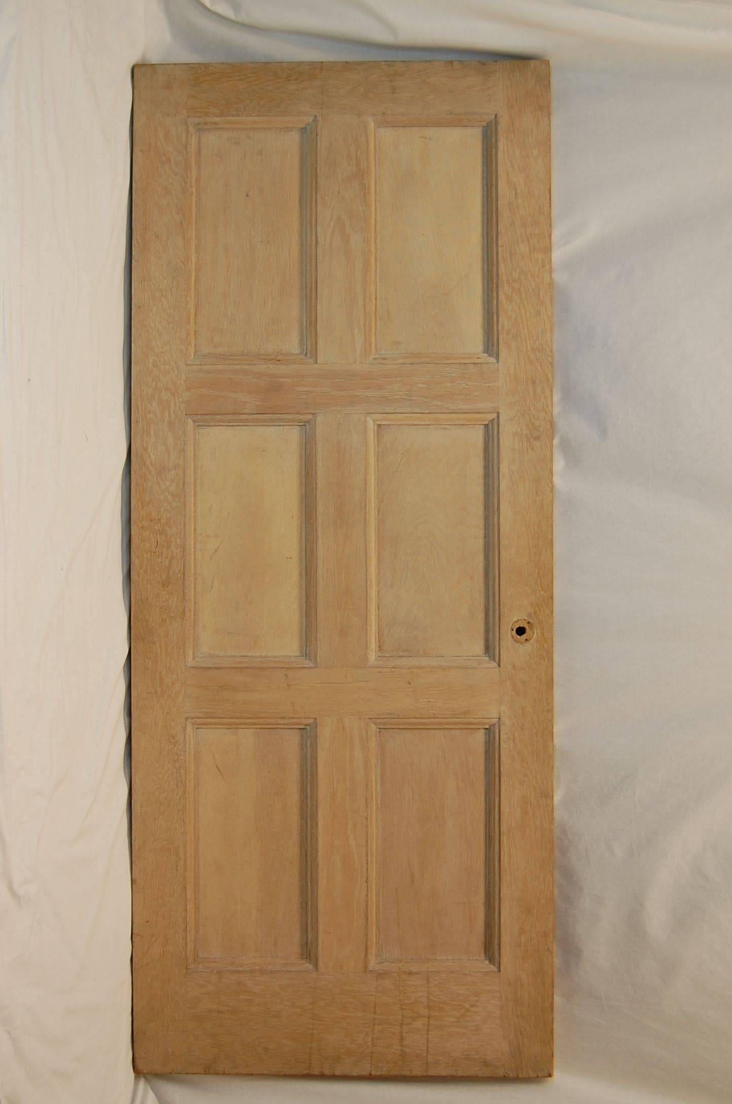 This oak door has been stripped and is ready to be finished and installed. It is mortised for three- 4 inch hinges. Condition is excellent. Removed from a mansion in Pittsburgh's Murdoch Farms region.