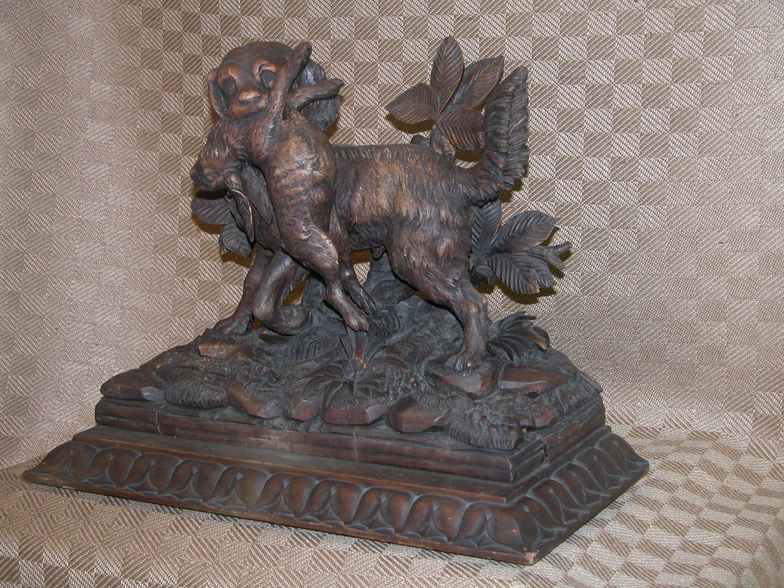 Hand-Carved Black Forest Carving of Hunting Dog with Rabbit on Fancy Carved Base, circa 1850