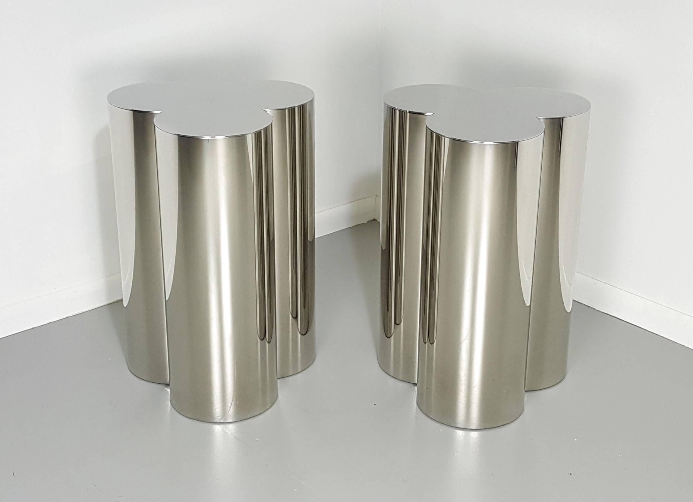 Trefoil dining tables base pedestals in mirror stainless steel. The finish appears as chrome. This is a custom-made product that is also available in polished brass. These pedestals are Industrial quality and designed to support large glass, wood,