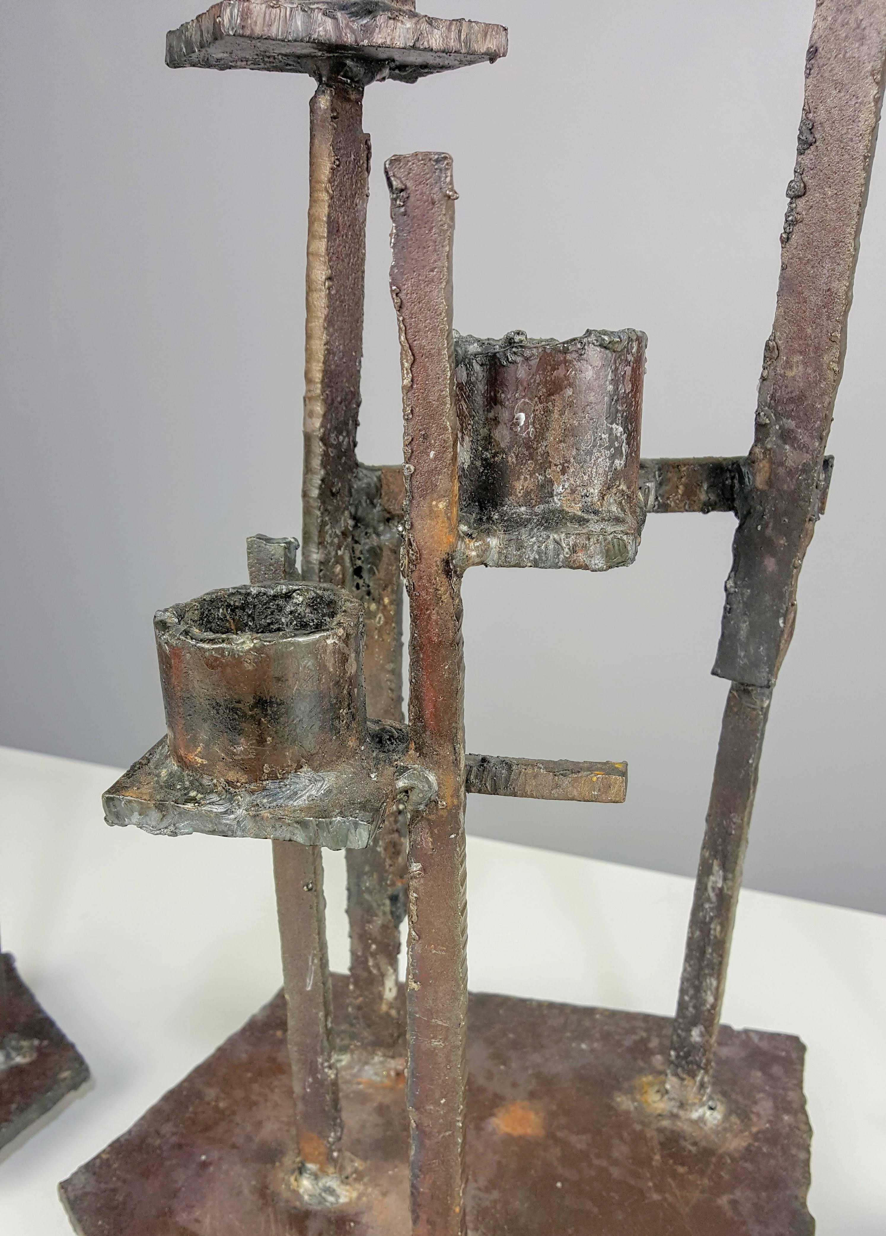 Monumental Trio of Brutalist Candlesticks with heavy patina in the manner of Paul Evans. Excellent vintage condition and outstanding, impactful examples of 1960s-70s Brutalism. Extremely heavy and well-made. These may be seen in person at our NYC