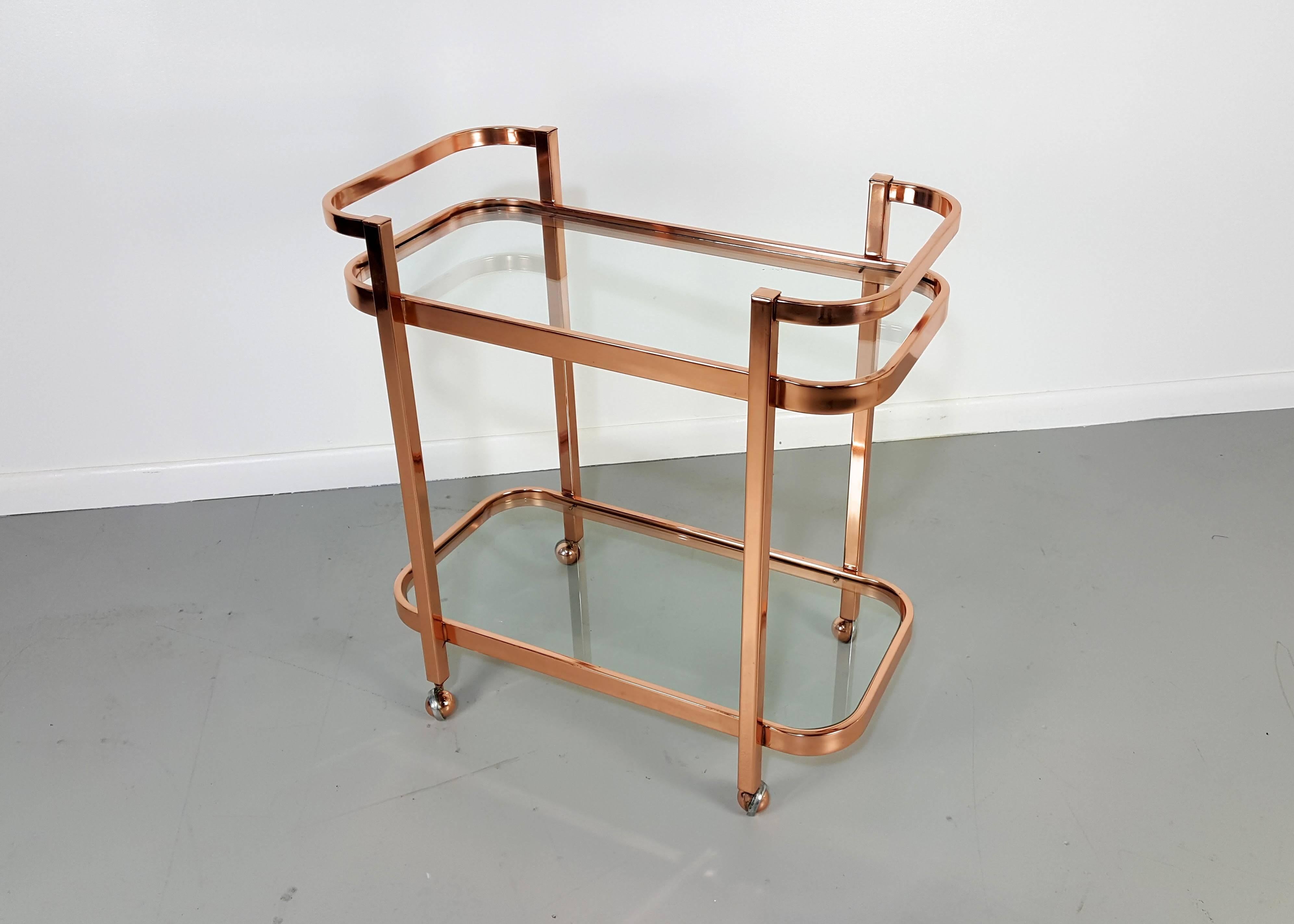 Stunning bar cart by Milo Baughman in rose gold copper, 1970s.

We offer free regular deliveries to NYC and Philadelphia area. Delivery to DC, MD, CT and MA are available if schedule permits, please message for a location-based delivery quote.