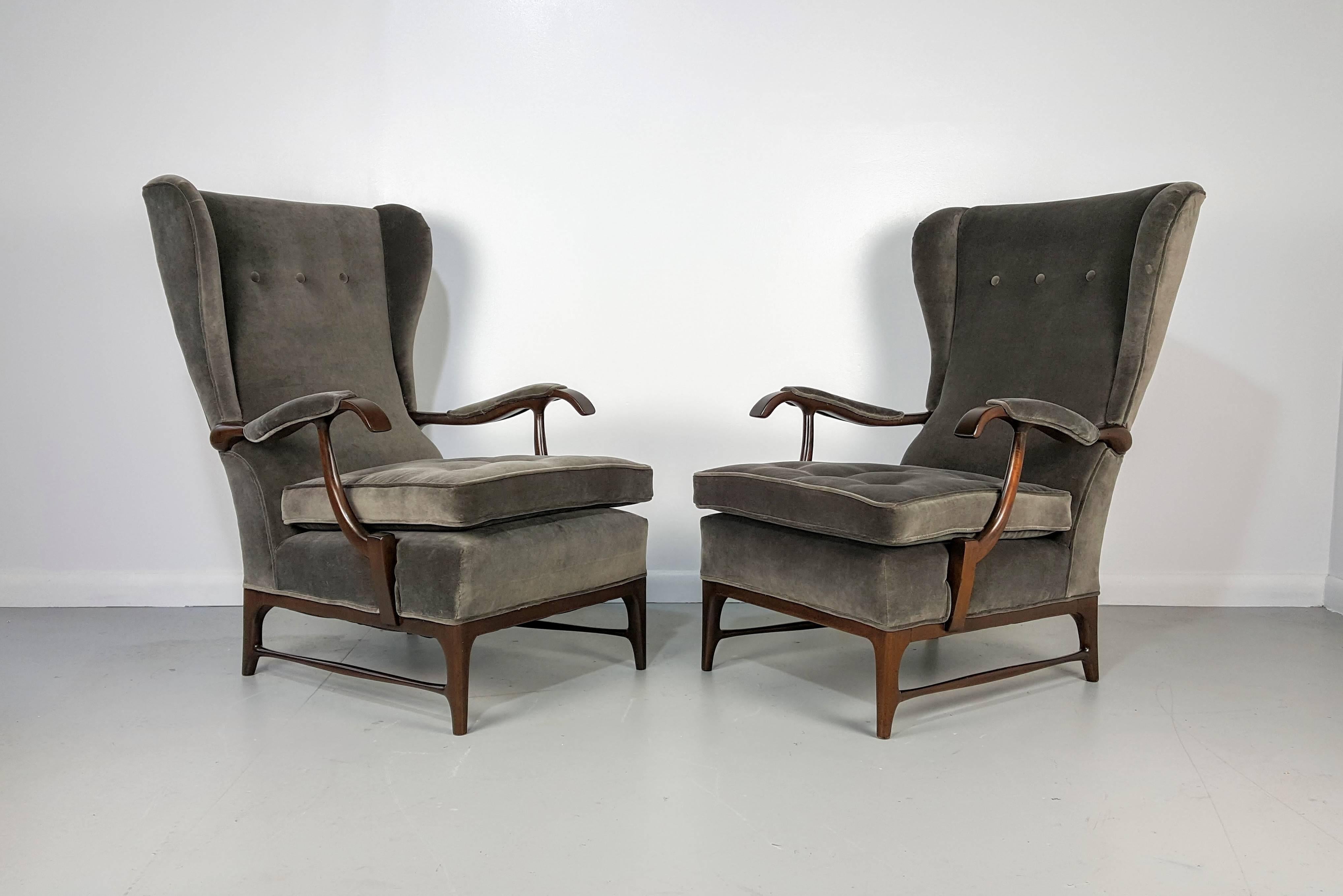 Pair of wingback lounge chairs by Paolo Buffa, Italy, 1950s. Beautifully restored with dark mahogany frames and charcoal velvet. 

See this item in our private NYC showroom! Refine Limited is located in the heart of Chelsea at the history