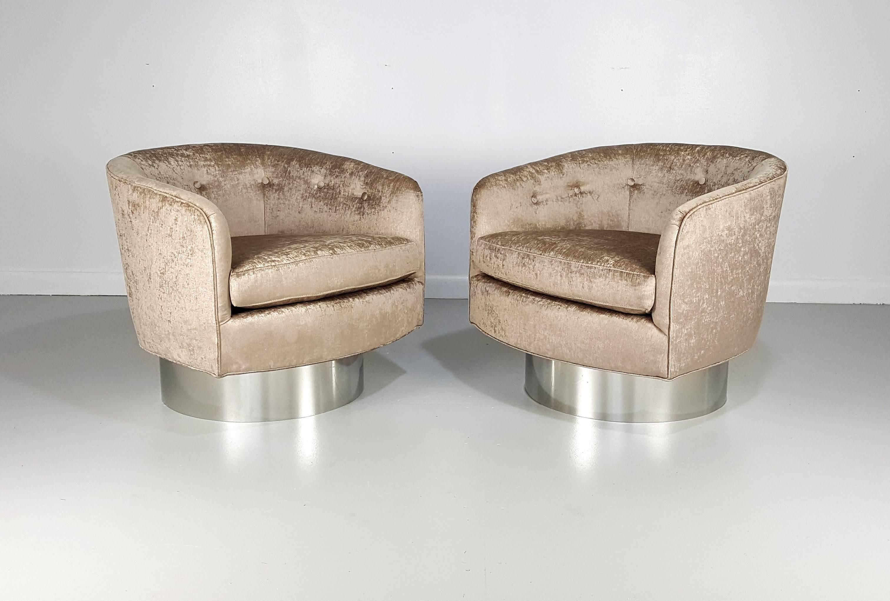 Swivel lounge chairs in velvet with chrome bases in the style of Milo Baughman's tub chairs. These chairs are designed and manufactured by Refine Limited. The frames are made from the highest quality materials by Pennsylvania Dutch craftsmen. They
