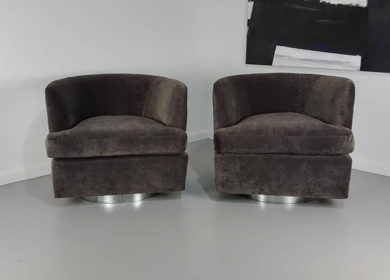 Milo Baughman chrome clad swivel lounge chairs for Thayer Coggin, 1970s. Incredible design and quality. Newly reupholstered in a soft low pile velvet. Chrome backs are in good vintage condition with normal wear, a few light dings and surface