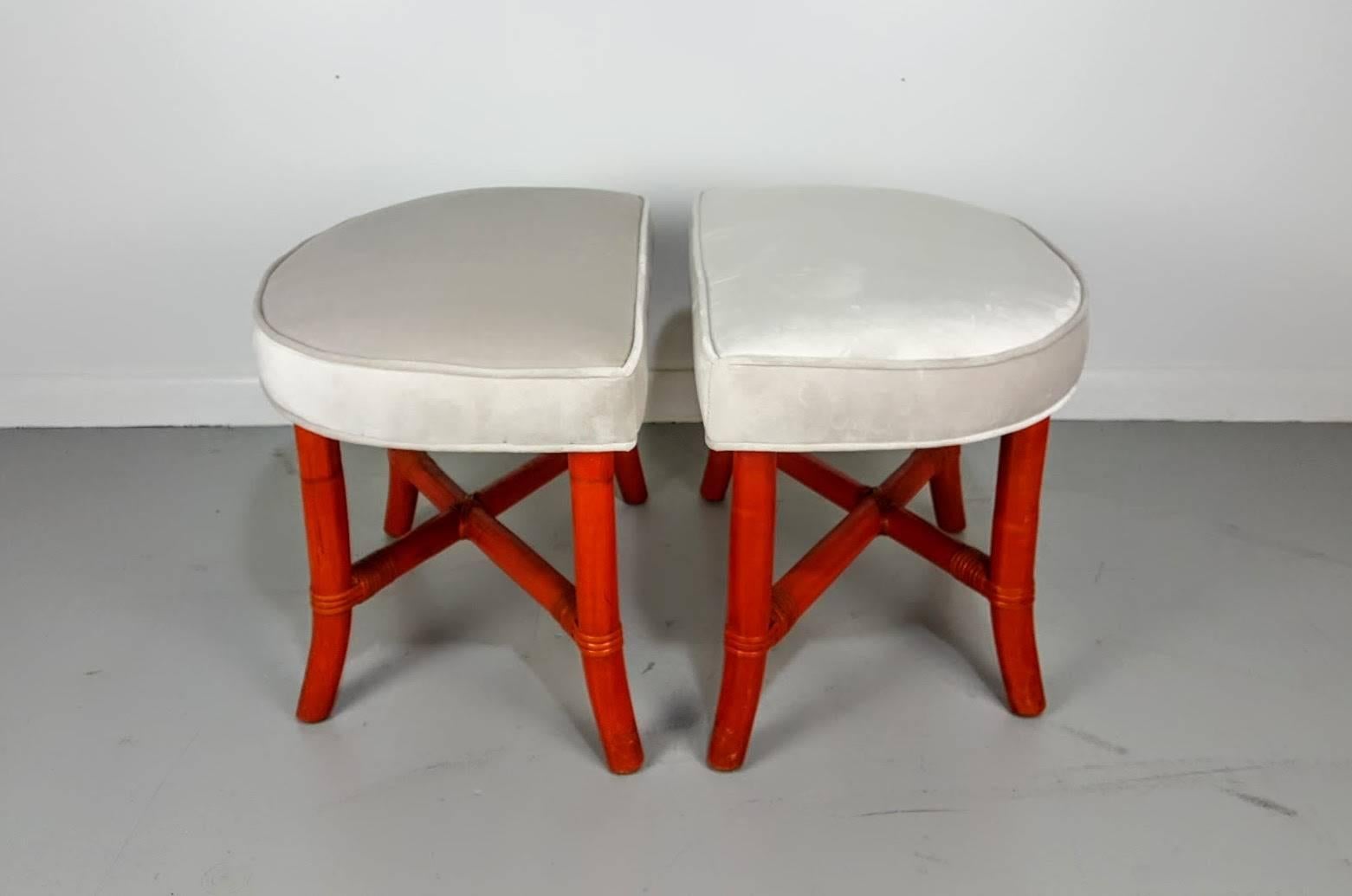 Pair of demilune Tommi Parzinger benches or ottomans for Willow and Reed, 1950s. Bent bamboo bases. Gorgeous original blood orange finish. Newly upholstered in a light gray velvet.

See this item in our private NYC showroom! Refine Limited is