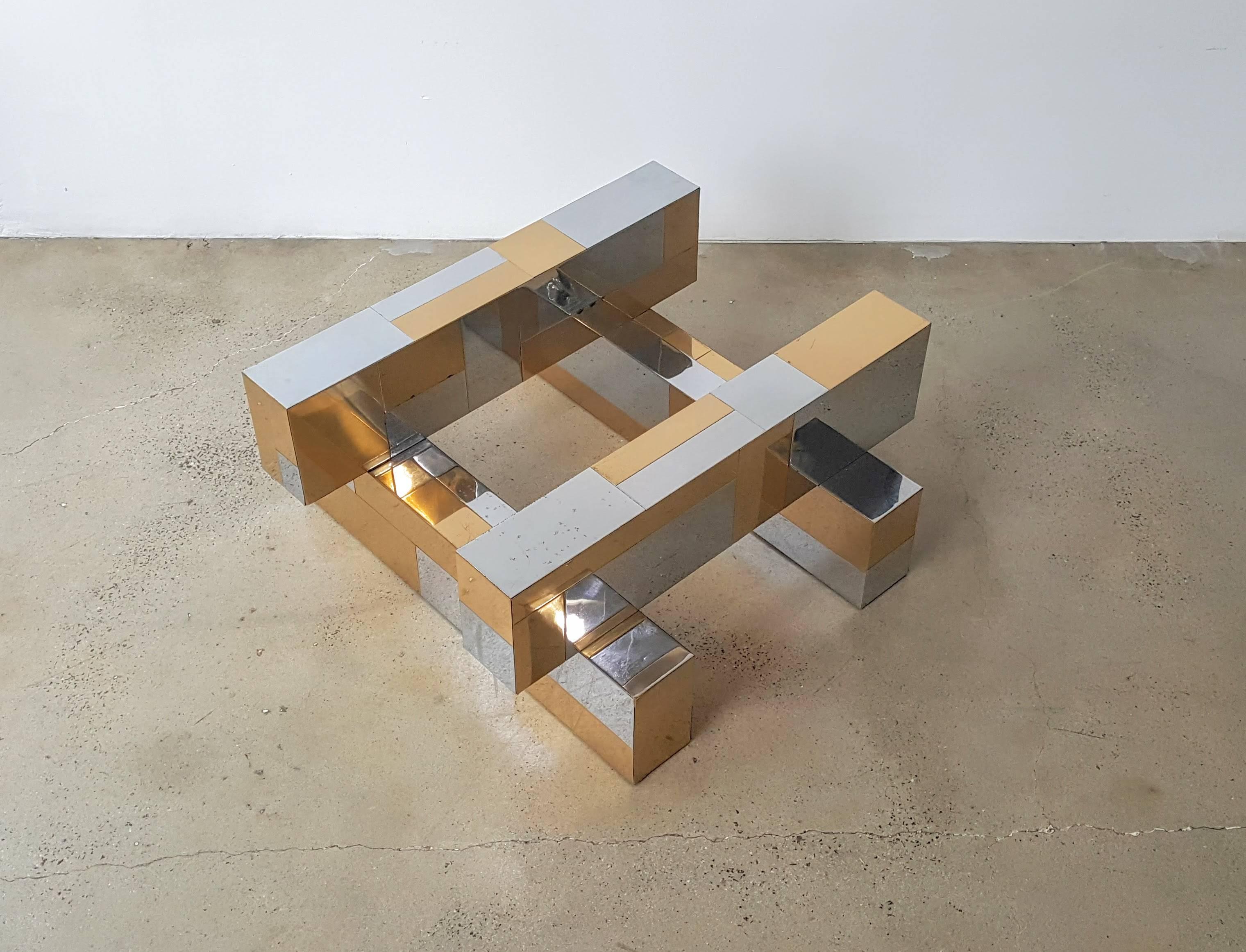 Glamorous Paul Evans Cityscape coffee table in brass and chrome, 1970s. This piece boasts the iconic brutalist cityscape tiling that made Paul Evans a commercial success in the 1970s. This specific example uses mixed metals which was also popular at