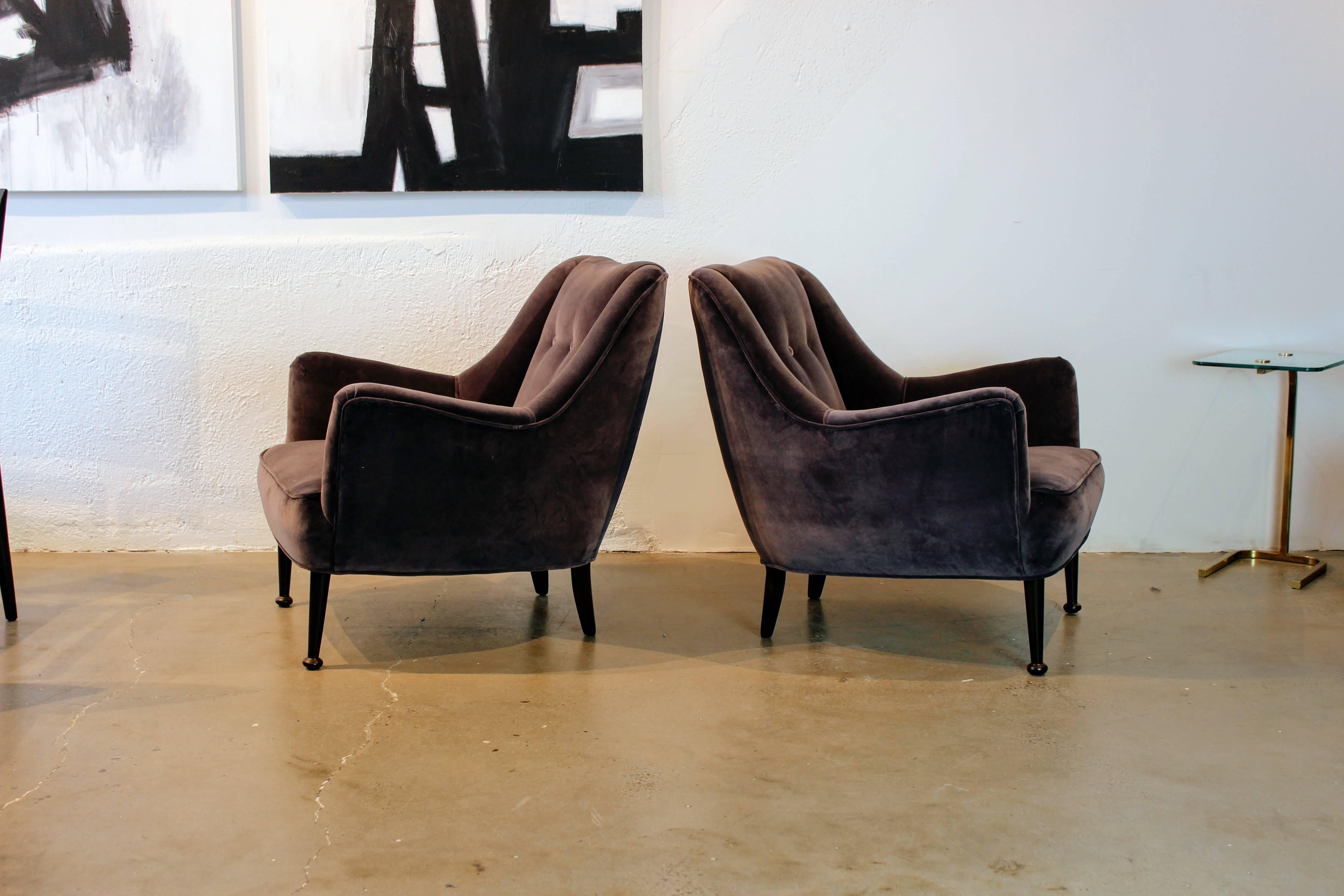 Pair of Gorgeous Mid-Century Modern lounge chairs in deep gray lilac velvet with sculptural walnut legs. Very comfortable and well made. The origin is unknown but they have both Danish and Italian modern characteristics. Fully restored and in