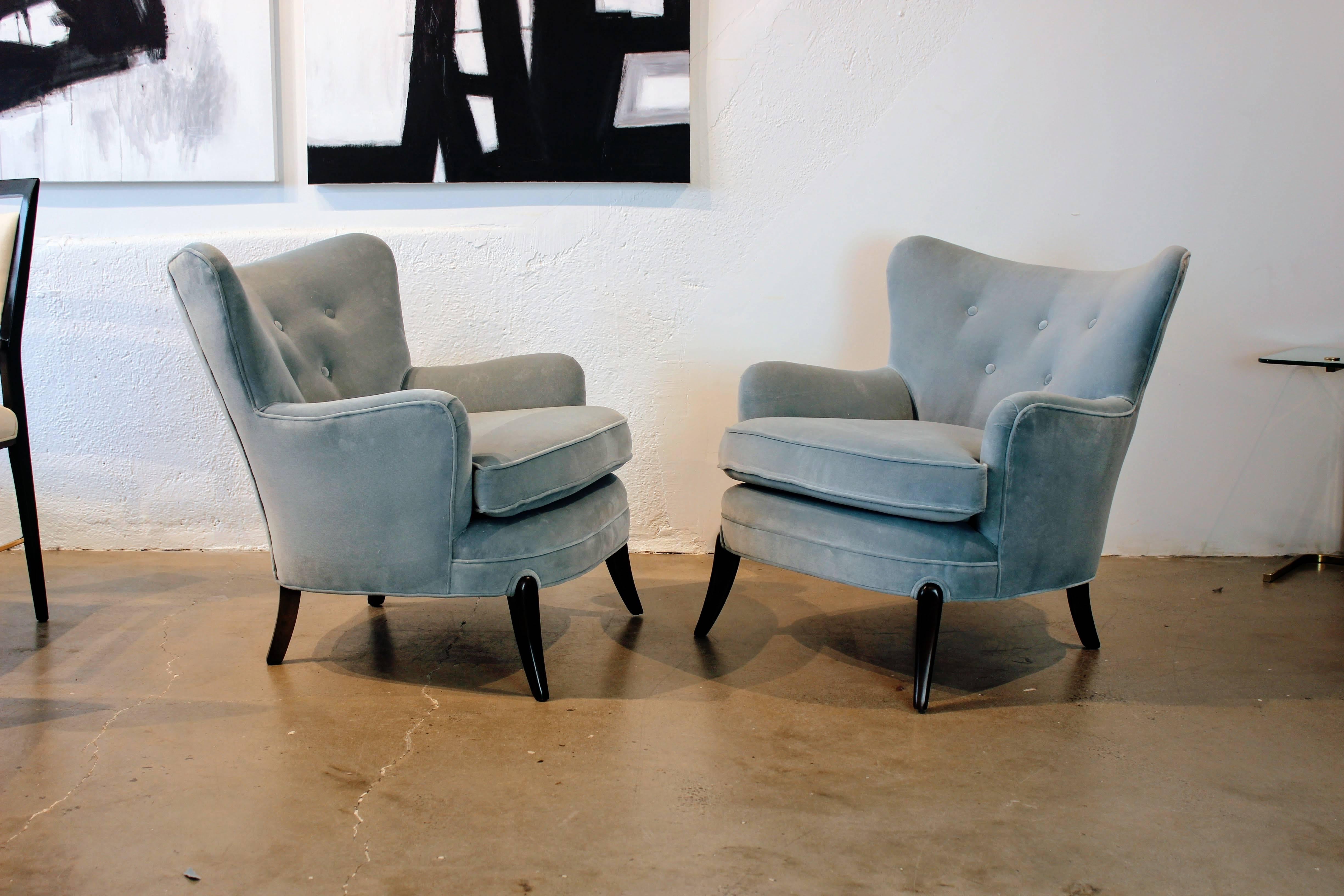 Wicked wing back lounge chairs attributed to Frits Henningsen or Carl Malmsten, 1950s. Sculptural sabre legs. Fully restored and in excellent condition. Very comfortable!

See this item in our private NYC showroom! Refine limited is located in the