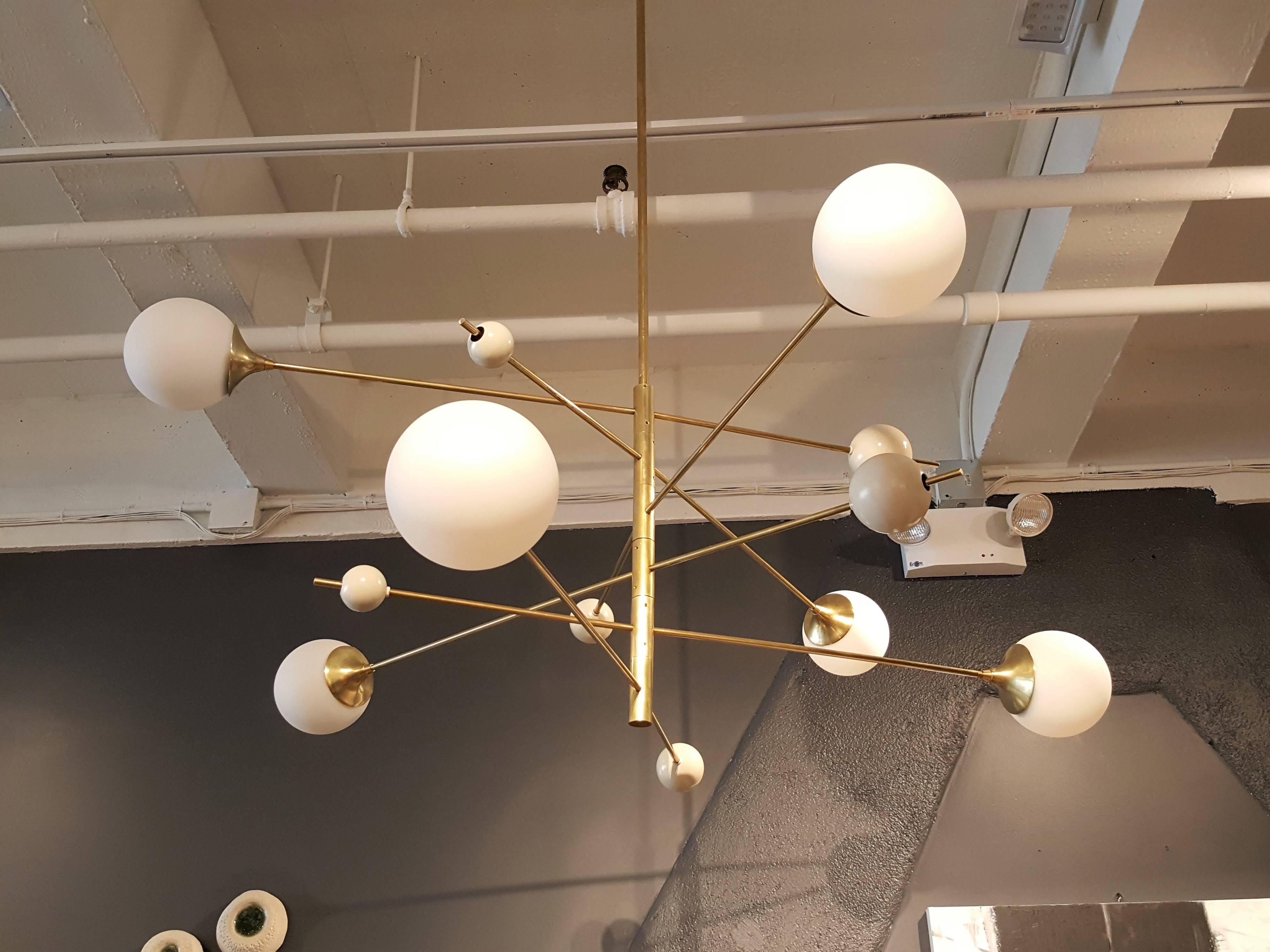 
Handcrafted in NYC by Studio Machina for Blueprint Lighting , our 'Orbital' Chandelier is a commanding statement piece with design elements of both Italian and French modernism as well as Hollywood Glam and is a stunning study in mixed materials.