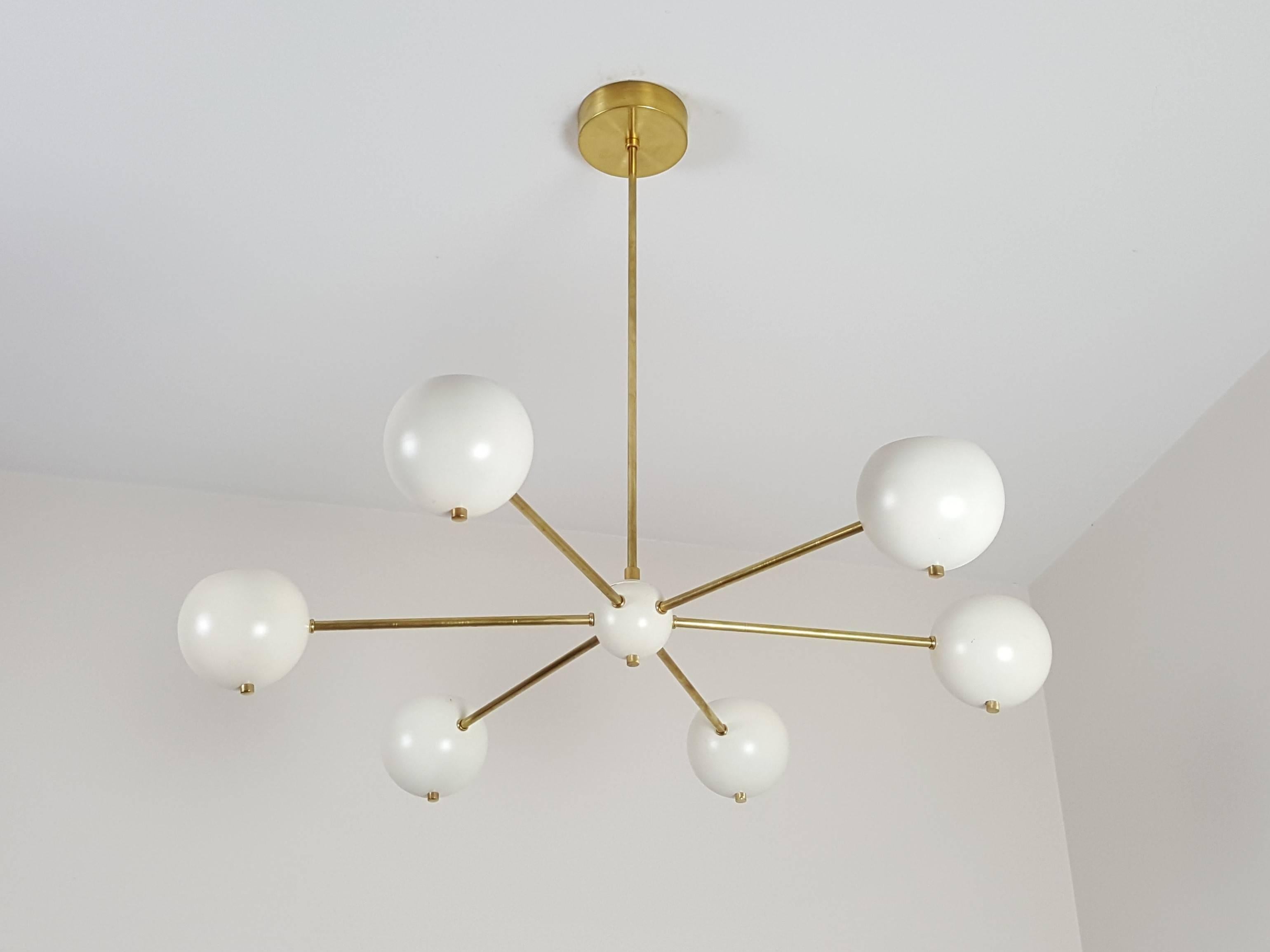 ASTER: a chic, simple brass chandelier with enameled spun aluminum orbs by Blue Print Lighting, 2017. This design is an Italian Modern classic with characteristics of both Mid-Century Modernism and Contemporary design. It offers a sculptural and