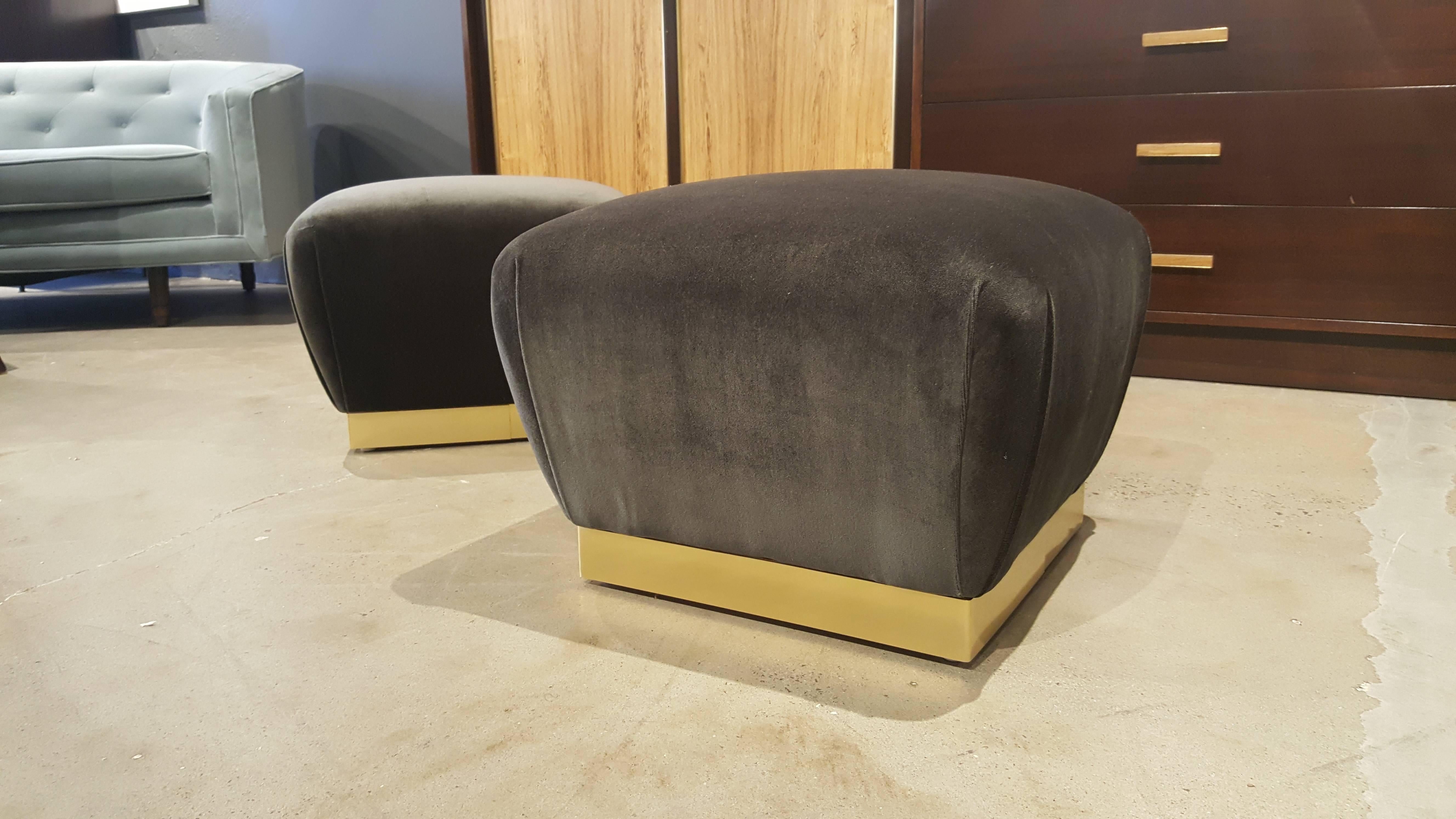 Stunningly glam pair of petite souffle poufs in the style of Karl Springer, 1970s. Completely restored with new brass wrapped bases and luxe mohair upholstery. The mohair is a dark charcoal with a lovely deep lilac undertone just beautiful.