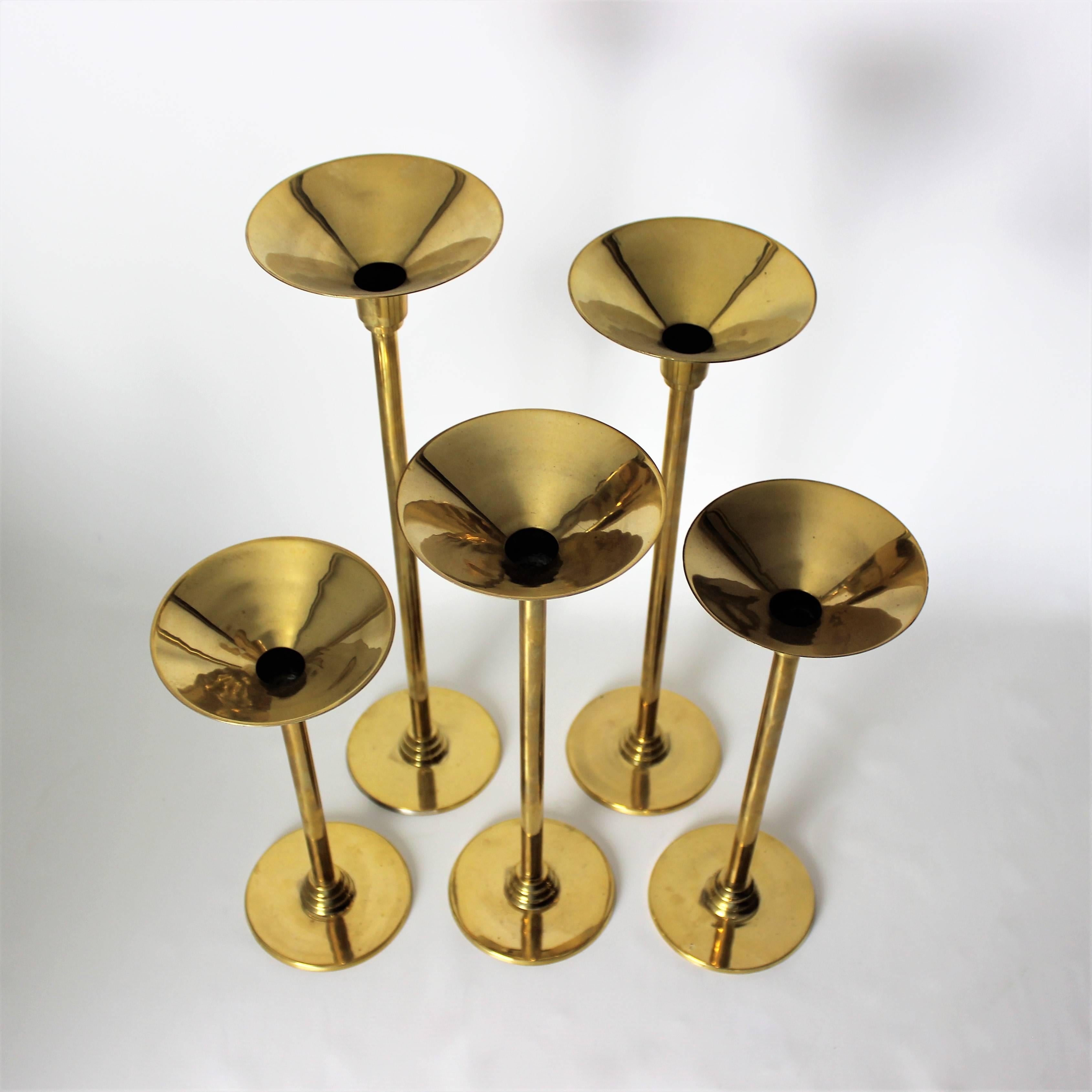 Late 20th Century Commanding 1970s Art Deco Revival Brass Candleholders in Graduated Heights