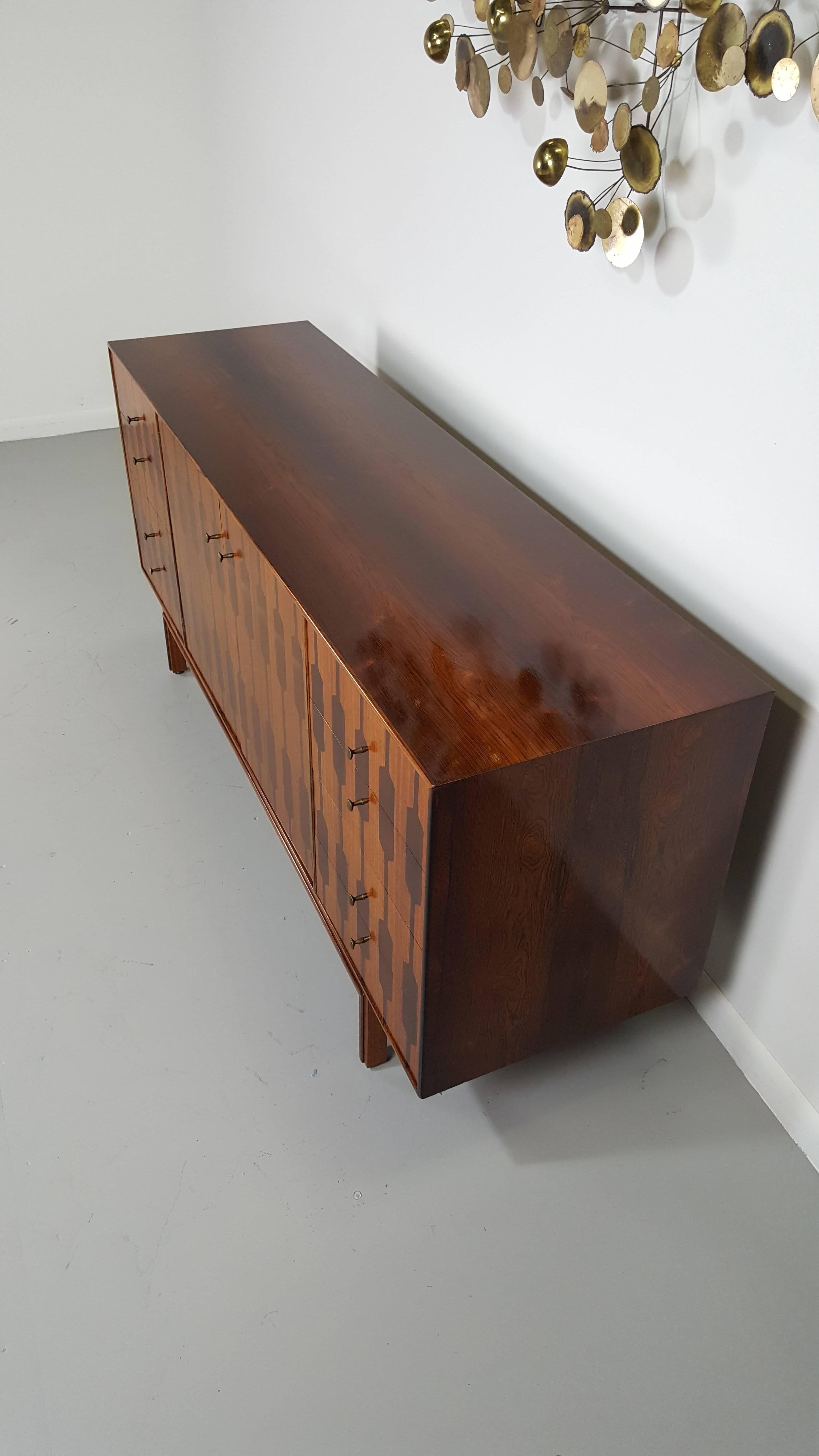 Amazing graphic rosewood and teak chest by Romweber, 1950s.

We offer free regular deliveries to NYC and Philadelphia area. Delivery to DC, MD, CT and MA are available if schedule permits, please message for a location-based delivery quote.
 