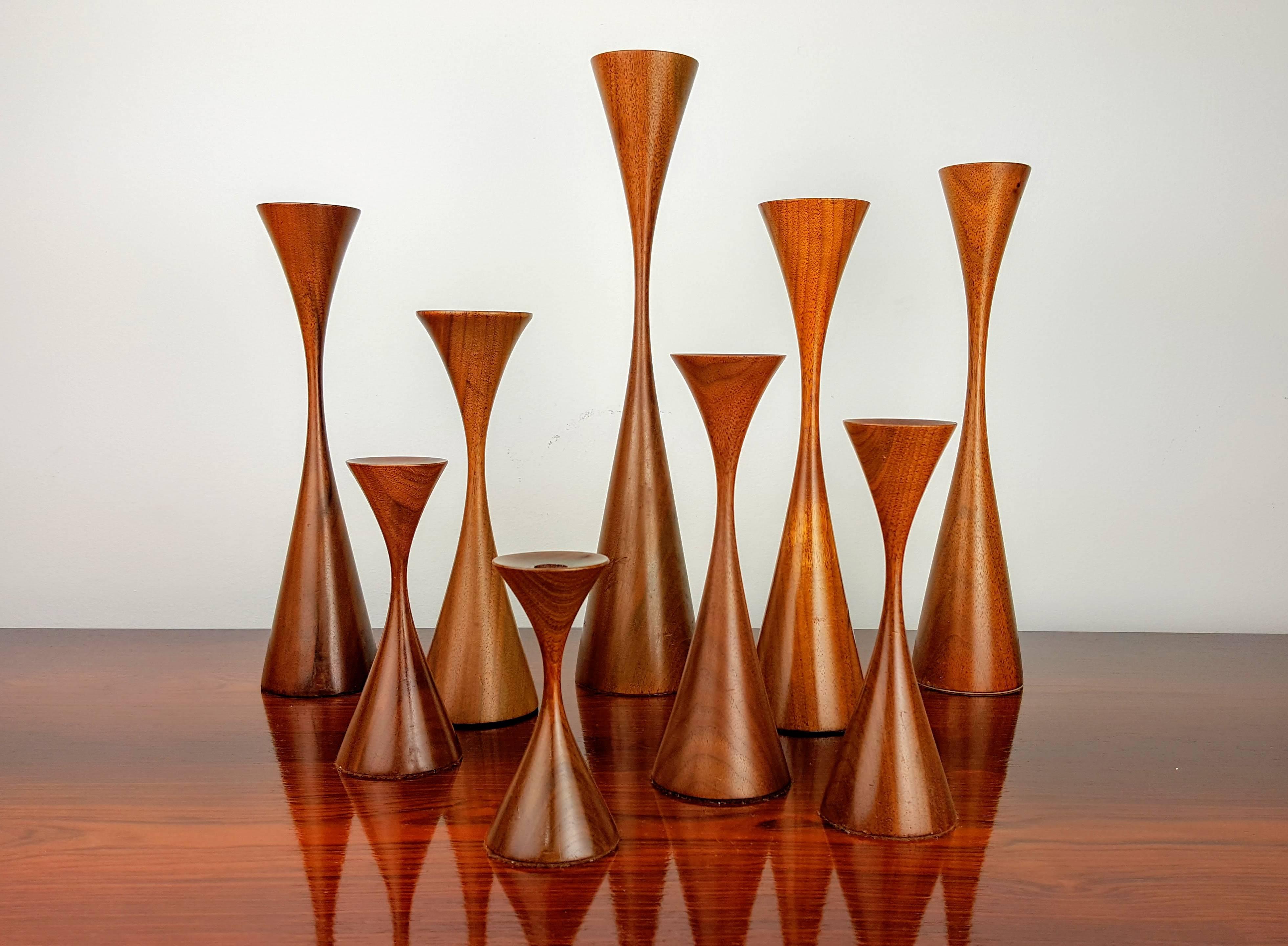 Grouping of nine masterfully turned wood candlesticks by Rude Osolnik, 1970s. Height of these pieces range from 4