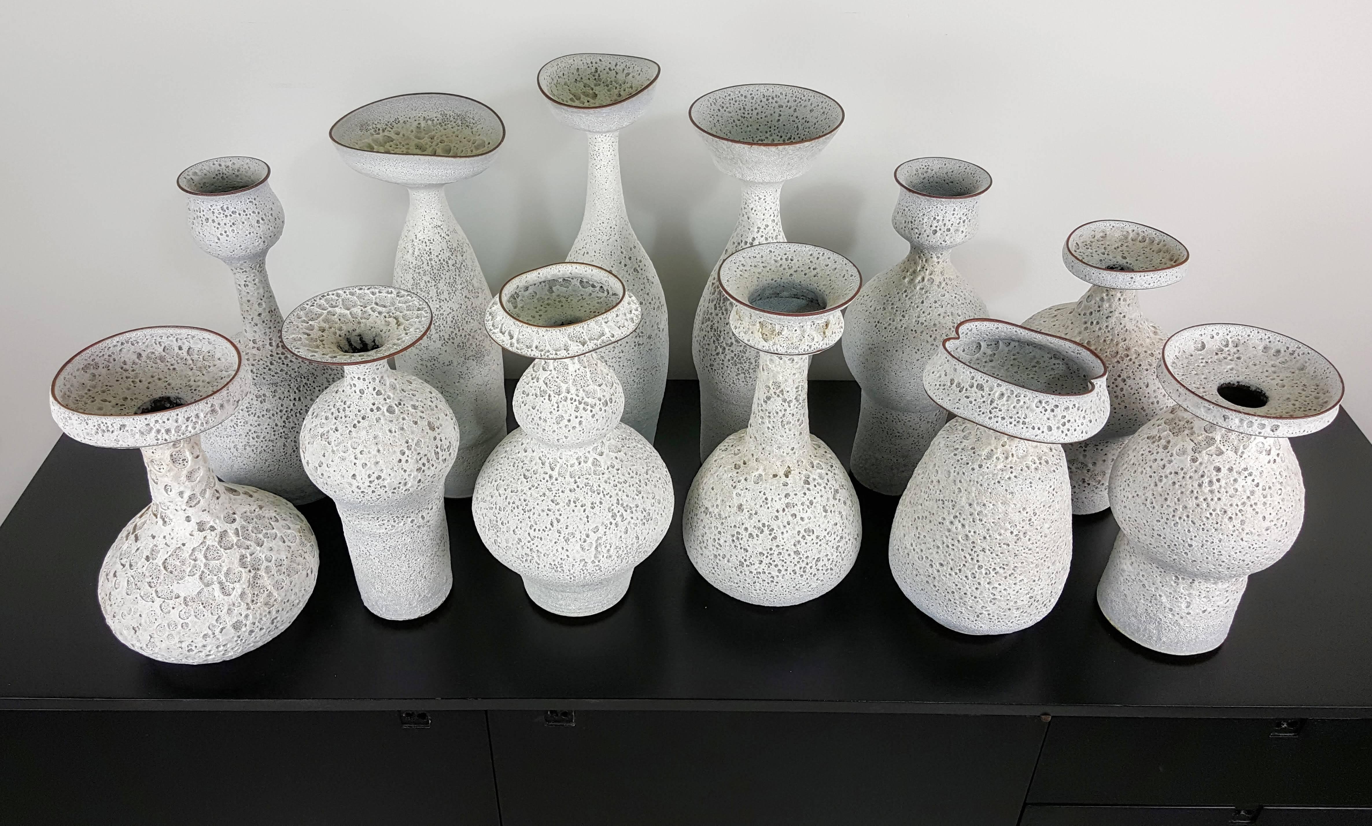 About

handmade Studio Pottery vases in a white crater glaze by working studio potter, Jeremy Briddell (b.1971). Pieces shown here range from 10