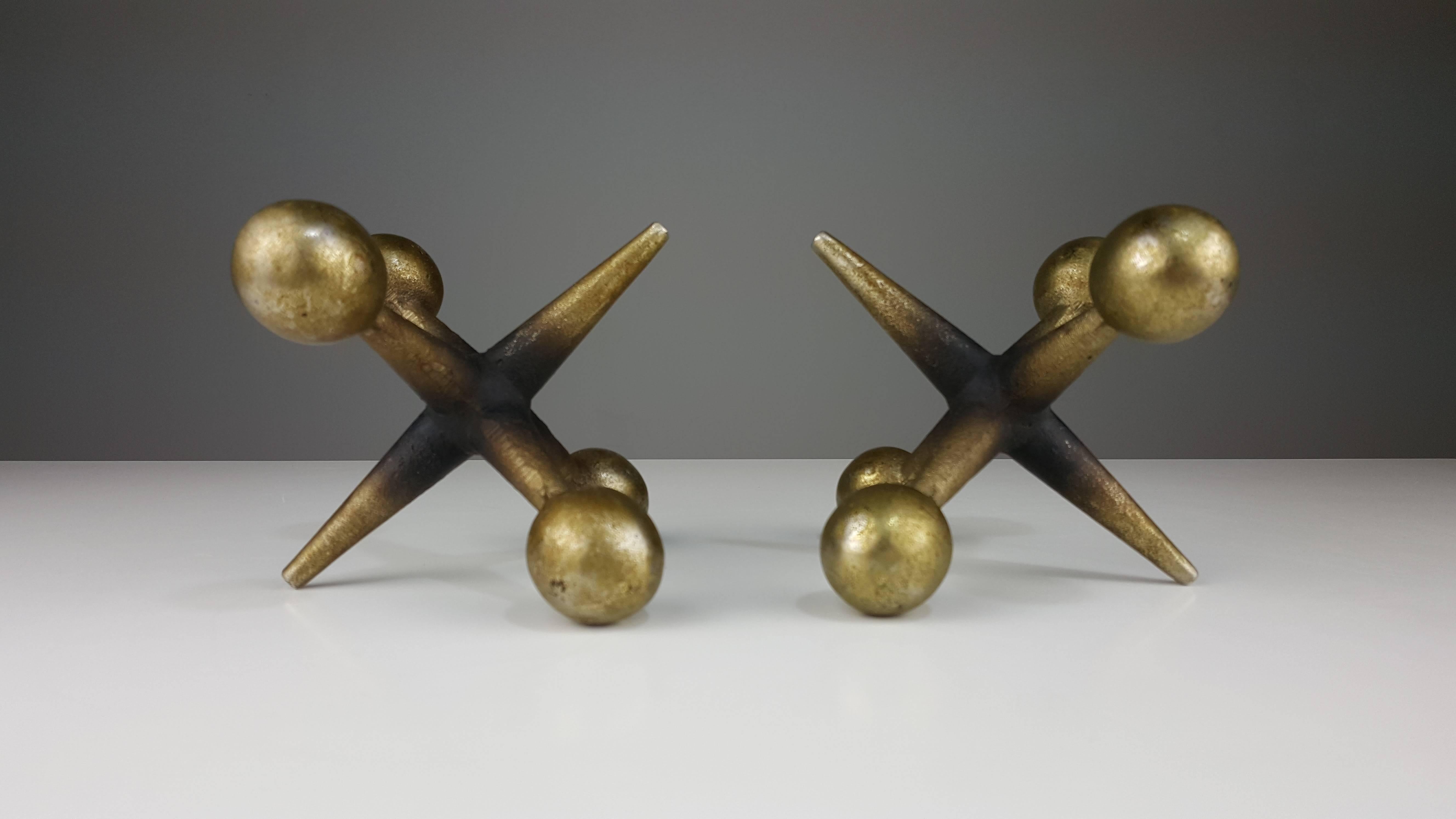 Pair of finely patinated brass Jacks Bookends after Billy Curry, 1970s. Wear throughout.

In the style of George Nelson, Billy Curry, Ben Seibel, etc.