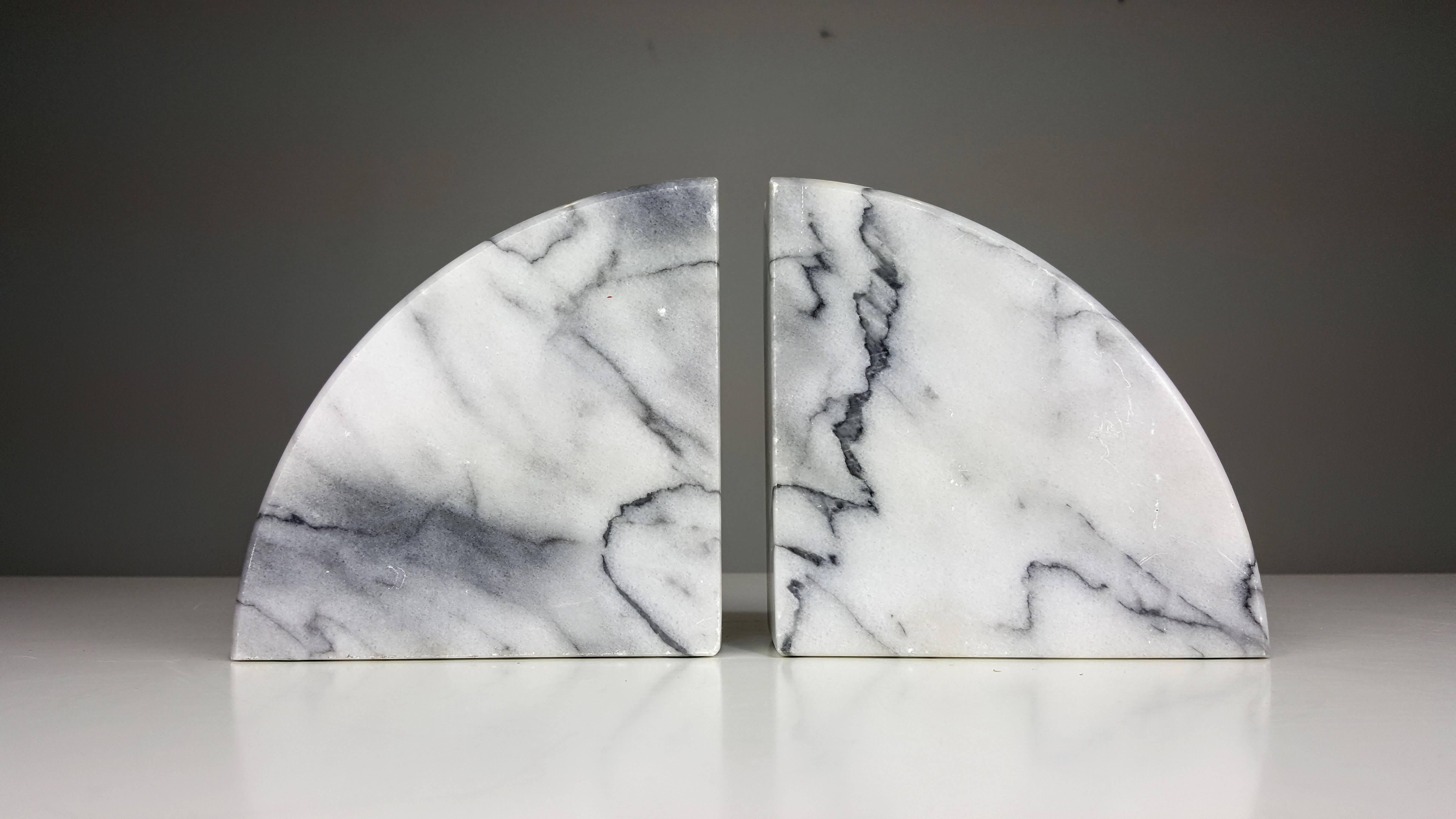 Heavy demilune Carrara marble bookends, Italy.
