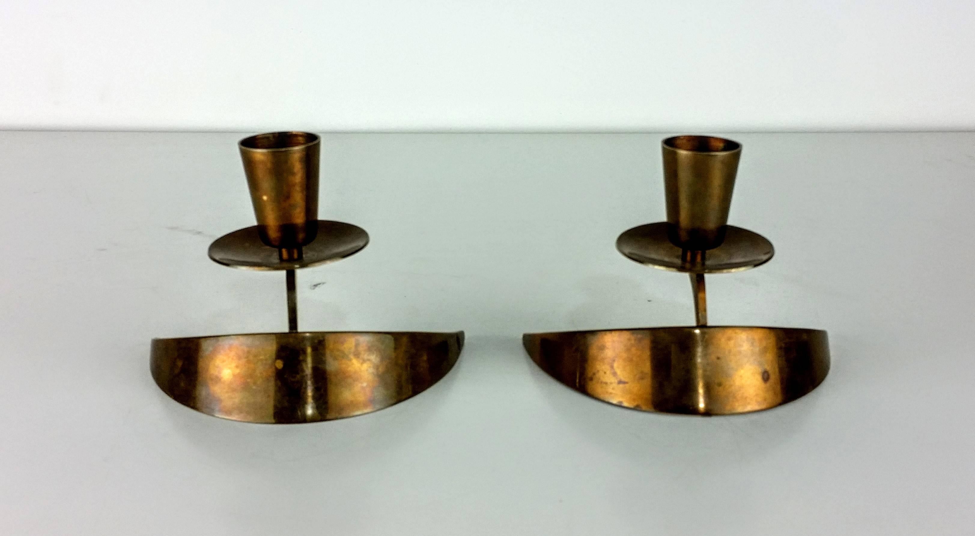 Rare pair of solid bronze candle holders by John Prip and Ronald Pearson. Excellent patina. Designed during the shop one period in the early 1950s. Stamped with 