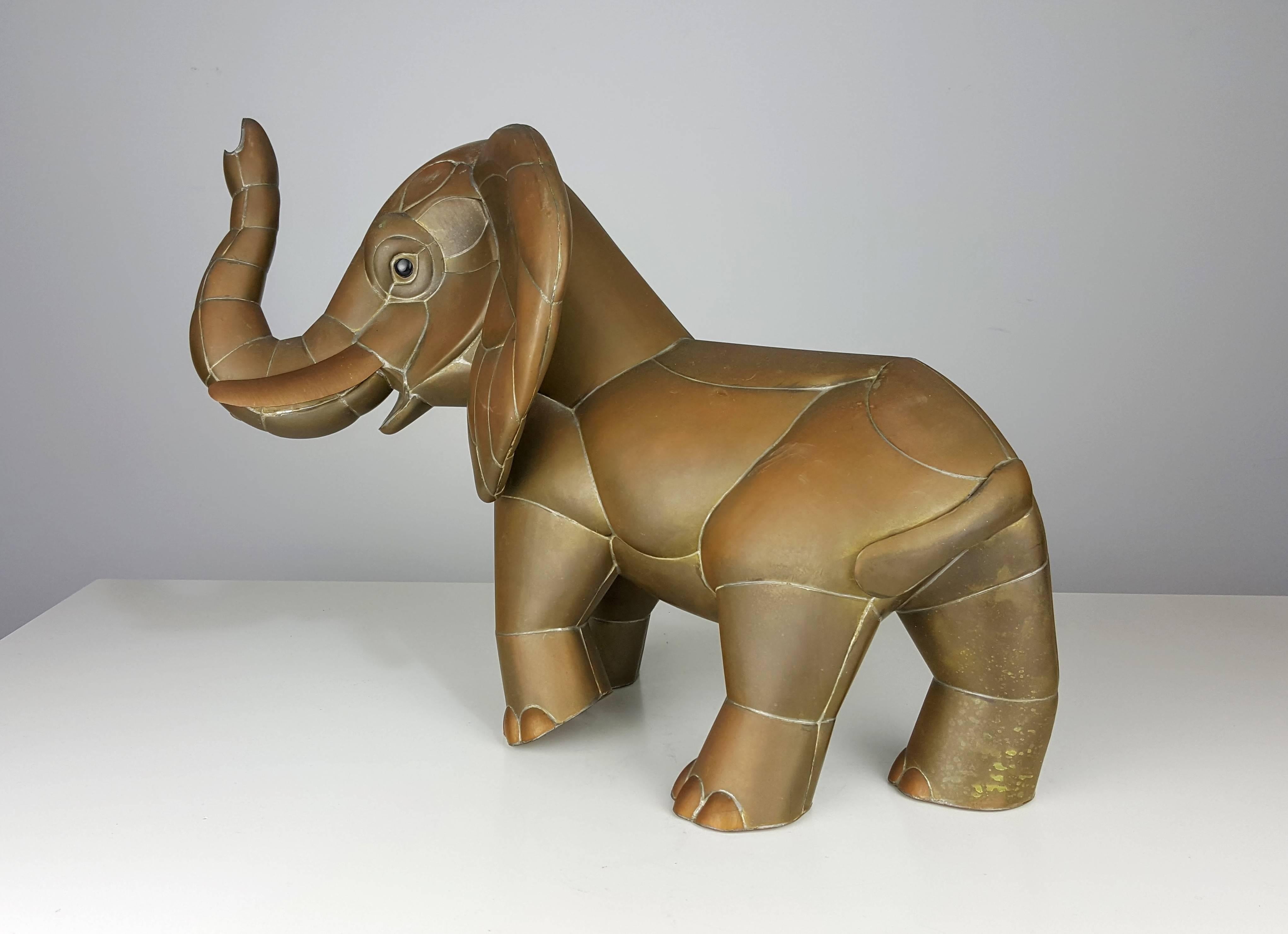 Fancy brass and copper elephant sculpture by Sergio Bustamante, Mexico. Exceptional craftsmanship and detail with a beautiful antique patina. Excellent condition. This piece is unsigned.

See this item in our private NYC showroom! Refine Limited
