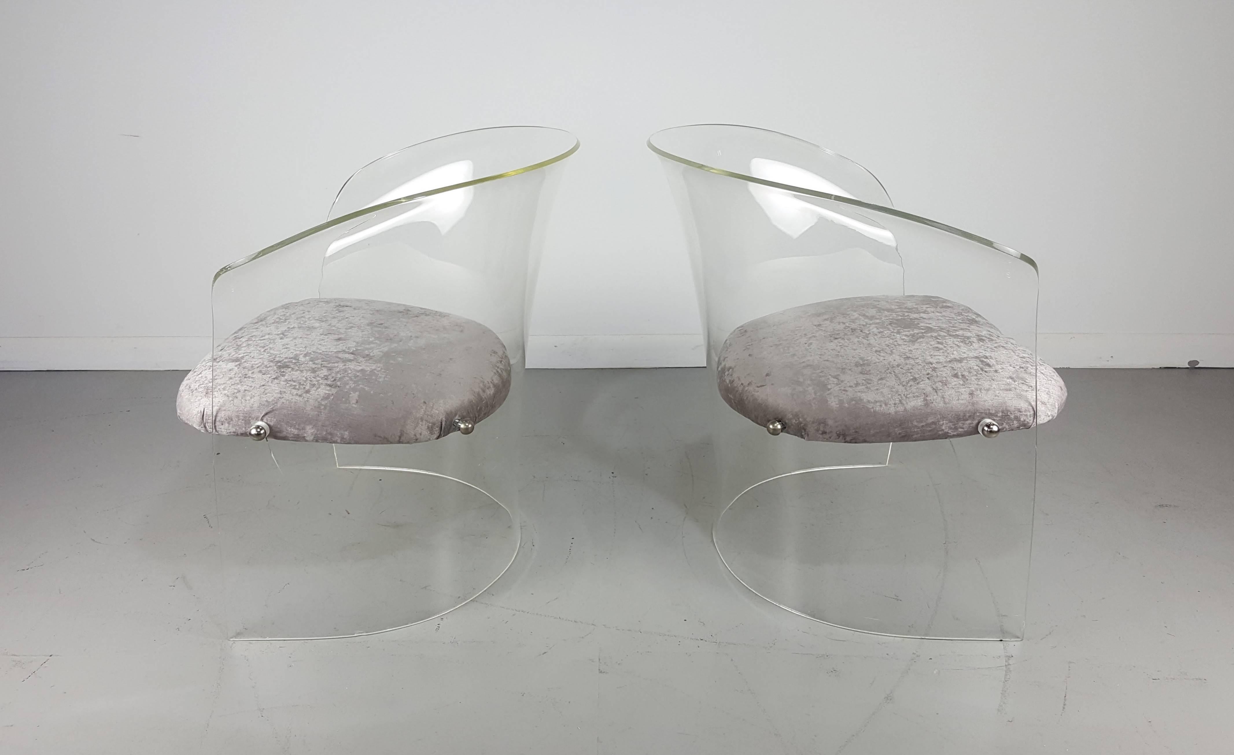 Lucite lounge chairs after Charles Hollis Jones, 1970s. Newly upholstered in silver velvet. Overall good condition. Lucite shows normal wear. Small scuff and a crack around one of the exterior bolts.

See this item in our private NYC showroom!