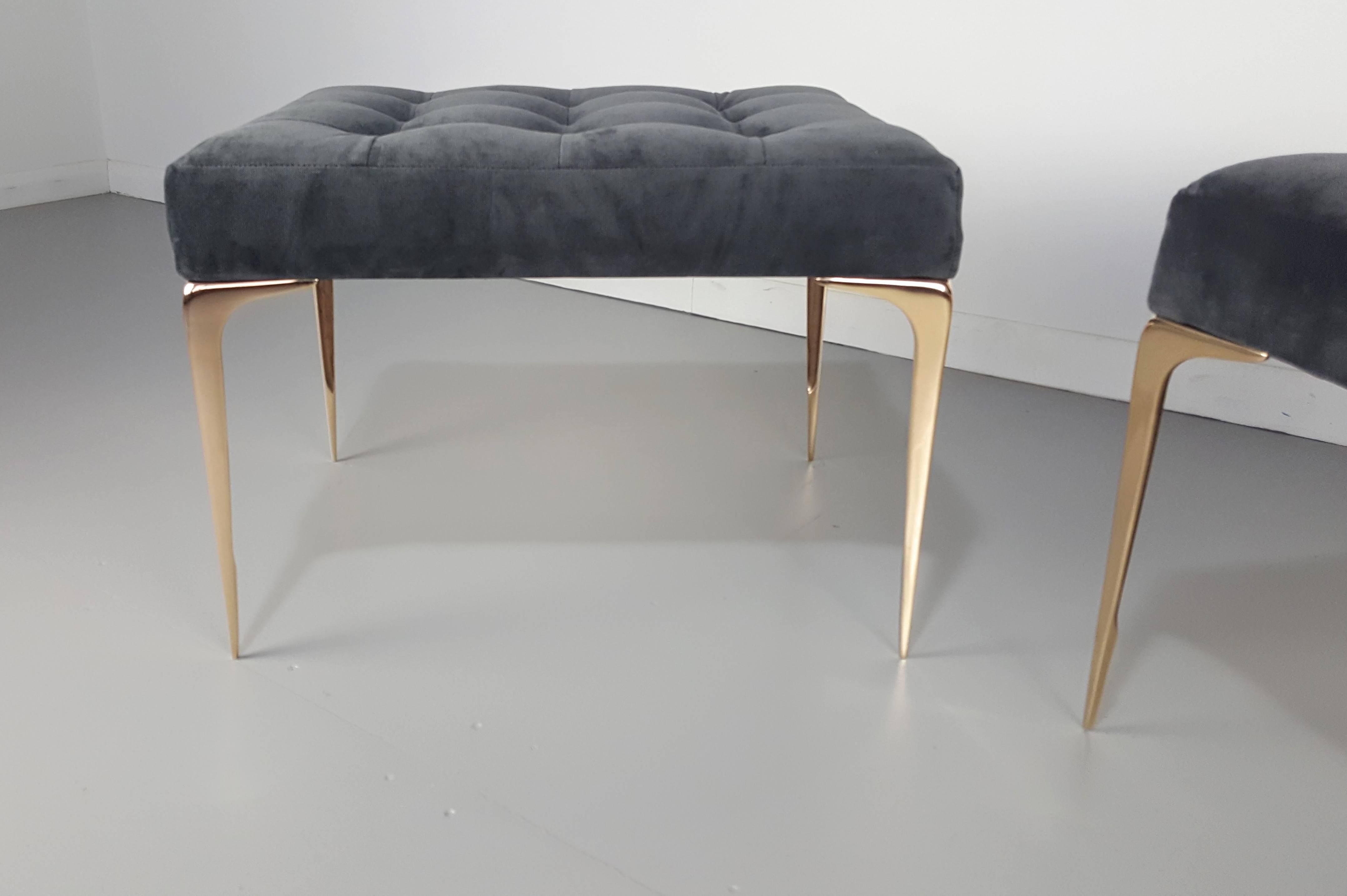 Pair of Italian modern ottomans or benches in velvet with a solid bronze tapered leg. Our Lancia bench leg is an exact preproduction of a 1950s Italian design. Originally produced in brass, our version is hand cast in solid bronze which has a