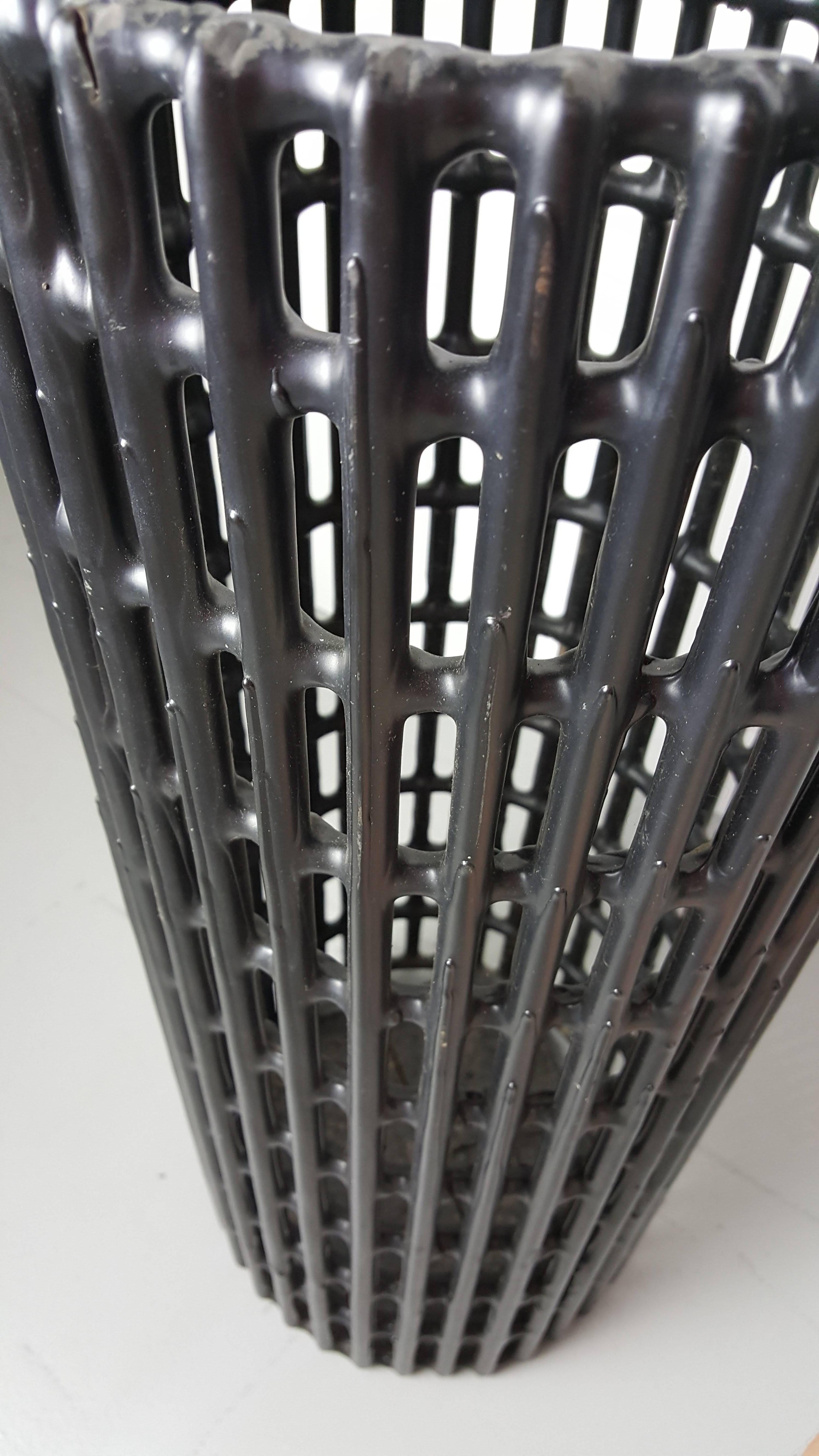 Industrial modern umbrella stand, circa 1970s. Rubber coated steel mesh construction. 