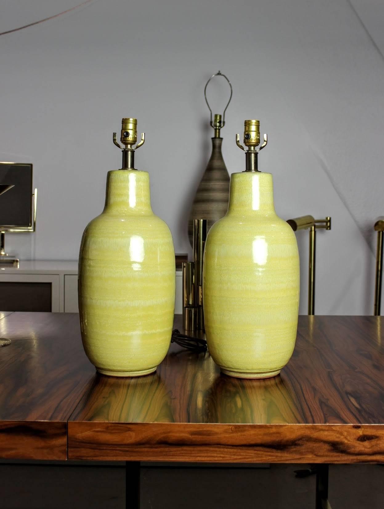 Vibrant yellow ceramic table lamps by Design Technics, 1960s. Beautifully thrown with a gorgeous yellow glaze with a modernist ginger jar shape. Such a great pop of color for any room. Excellent condition.

Dimensions: 22