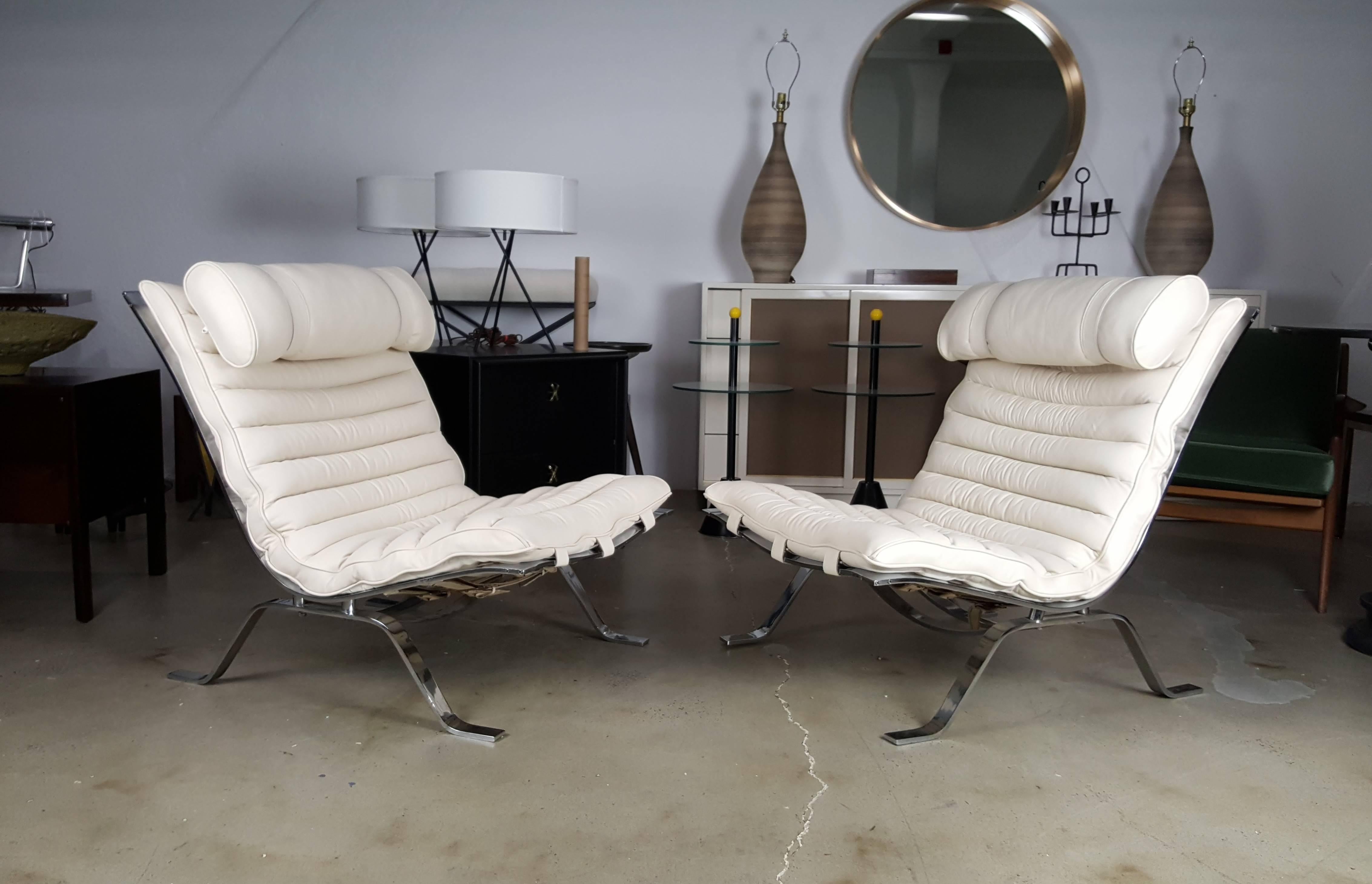 Pair of "Ari" lounge chairs by Arne Norell, Sweden, 1970s. Newly upholstered in a creamy white Italian leather. Excellent overall condition with normal wear to chrome.

See this item in our private NYC showroom! Refine Limited is located