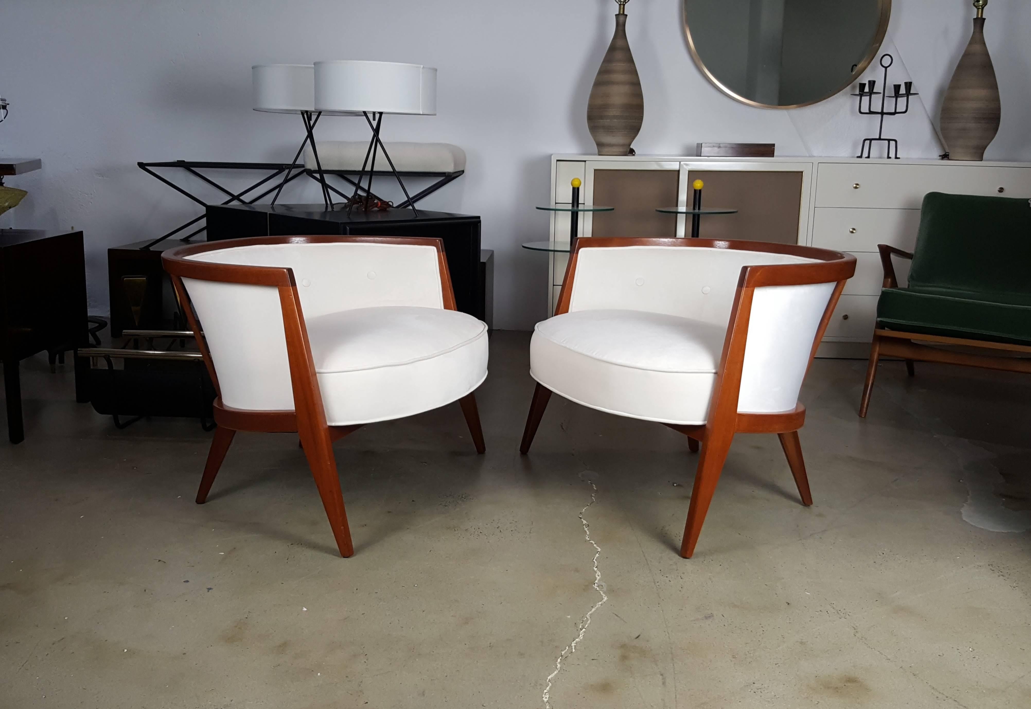 Sculptural mahogany lounge chairs by Harvey Probber, 1960s. Exceptional design. Low, wide and comfortable. These chairs have been fully restored in an ebonized finish with textured white velvet.

See this item in our private NYC showroom! Refine