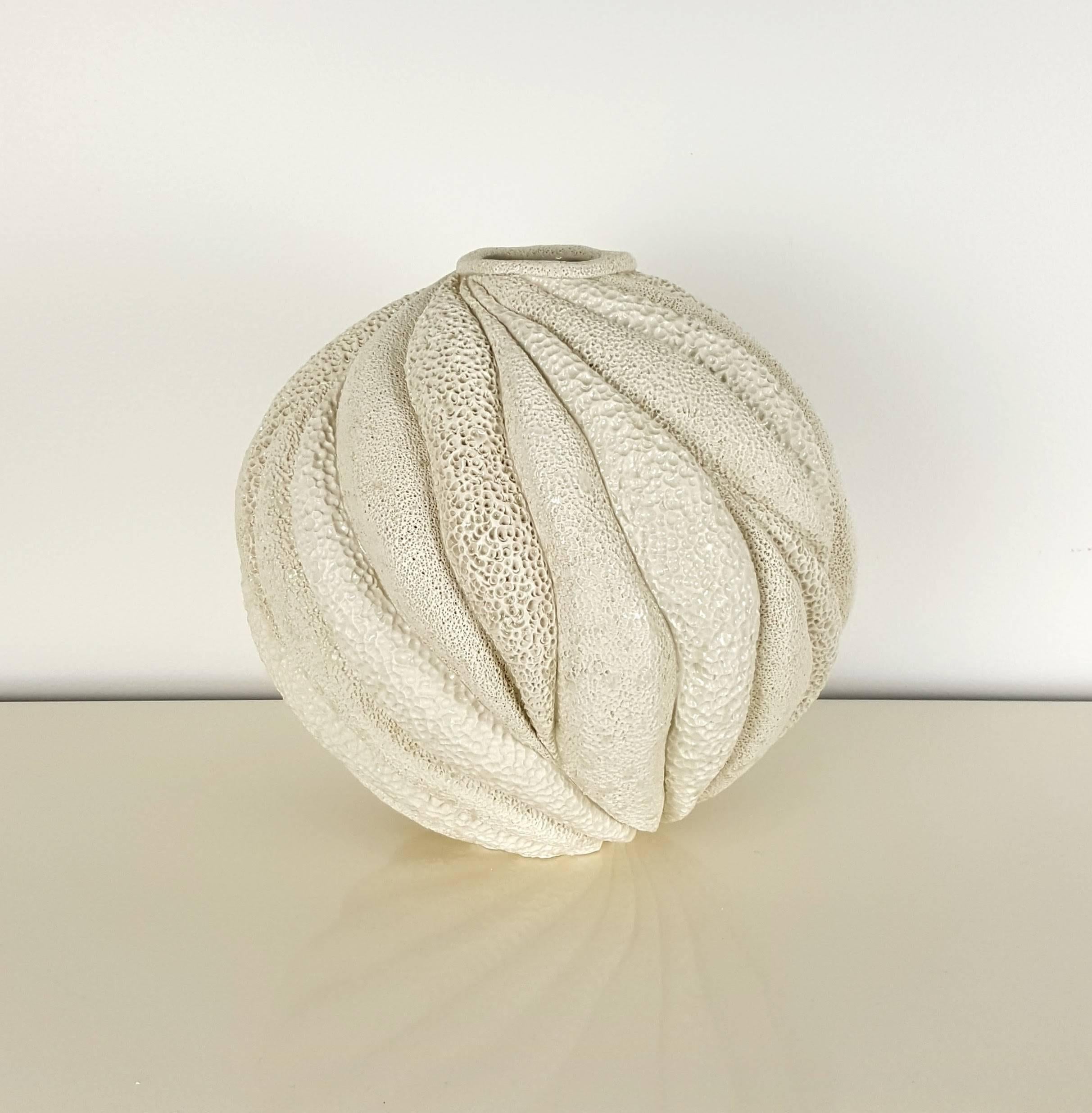 Creamy white large round coastal collage vessel by Judi Tavill, 2016. Hand thrown. The carved pieces are created with thick walls, deeply carved and painstakingly textured by hand. Pieces are coated with porcelain slip and further textured. After