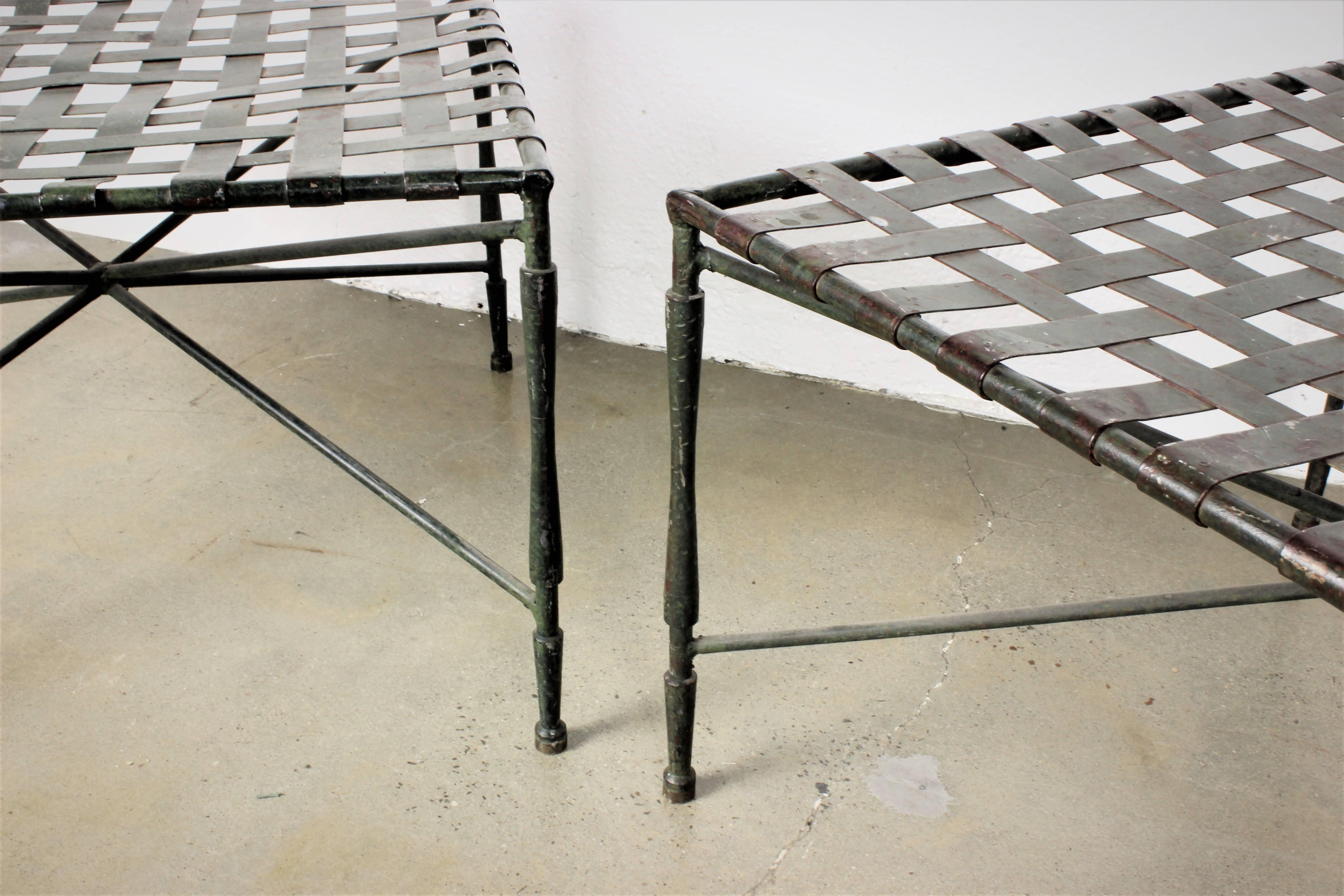Pair of architectural iron benches or ottomans by John Salterini, 1950s. Great patina with aged bronze finish. Great for indoor or outdoor patio. Very sturdy and heavy. 

Whether furnishing a contemporary Soho loft or stylish post-war Park Avenue