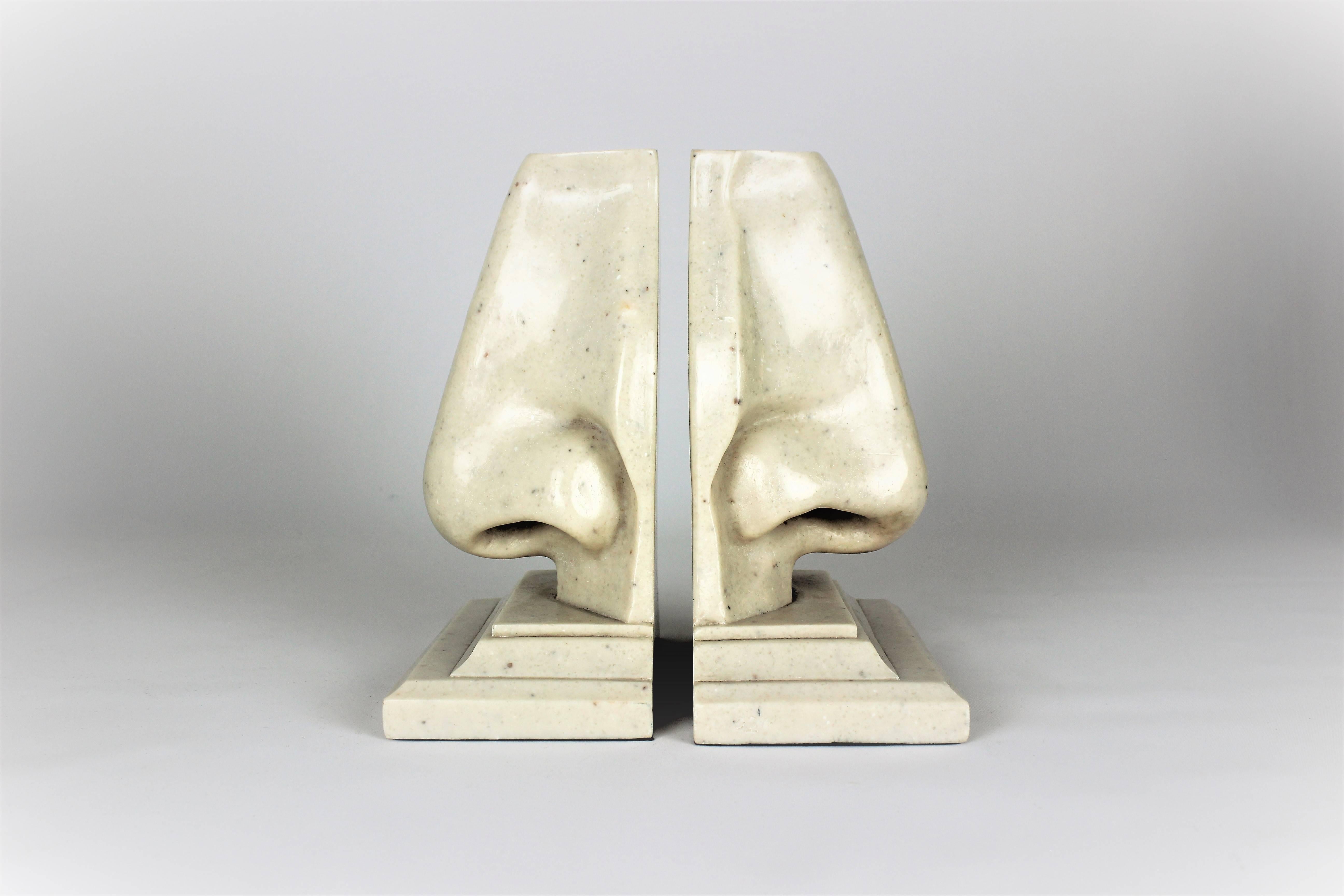 Large surrealist pop art marble nose bookends, Italy, 1970s. Perfect condition. What a fun decorative object! Very much in the style of Piero Fornasetti and Salvador Dali. 

See this item in our private NYC showroom! Refine Limited is located in the