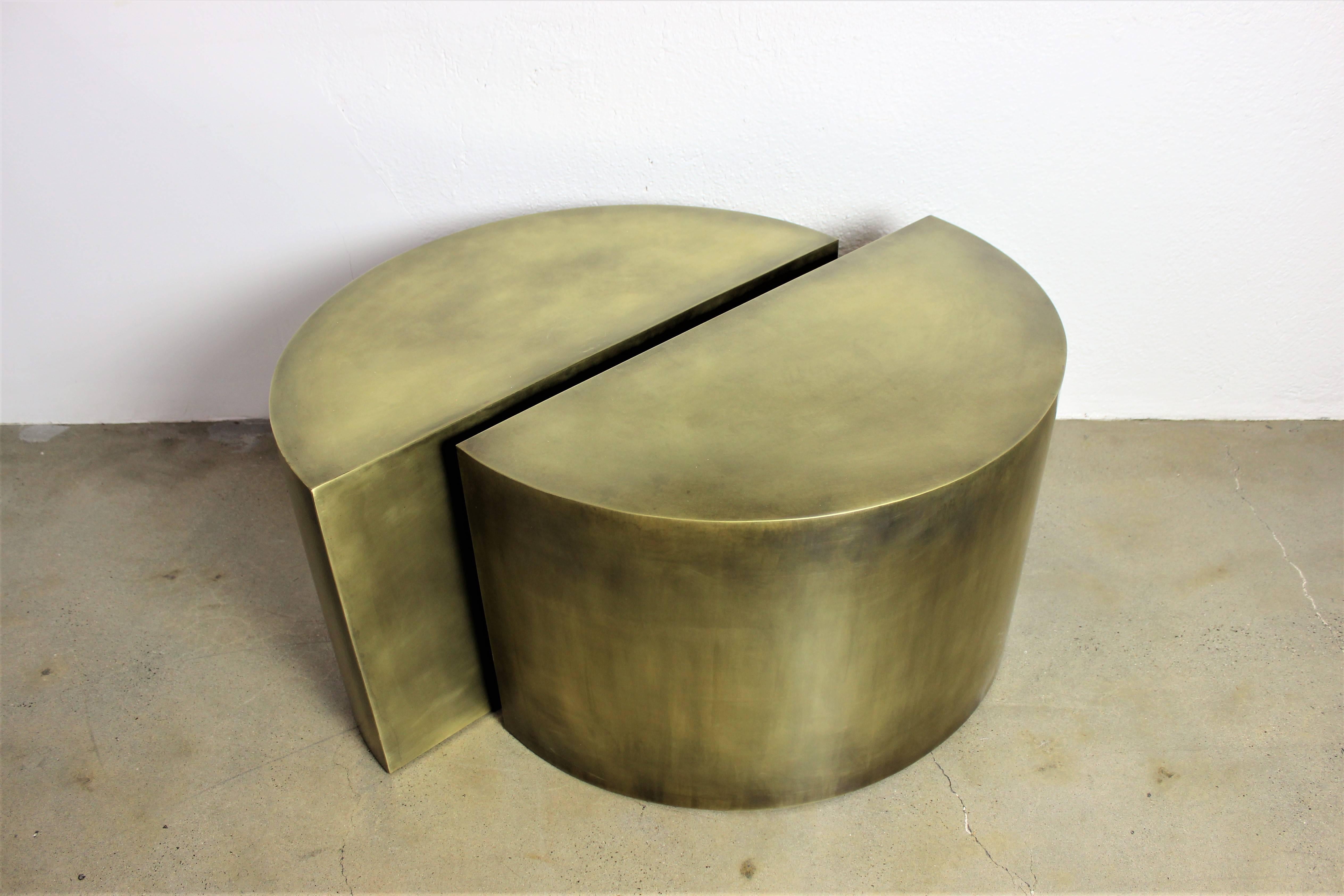 Solid brass geometric demilune side tables with heavy patina. Architectural, minimalist design made from the highest quality materials. These tables are contemporary artist-made pieces and were meticulously handcrafted in New England. The antique