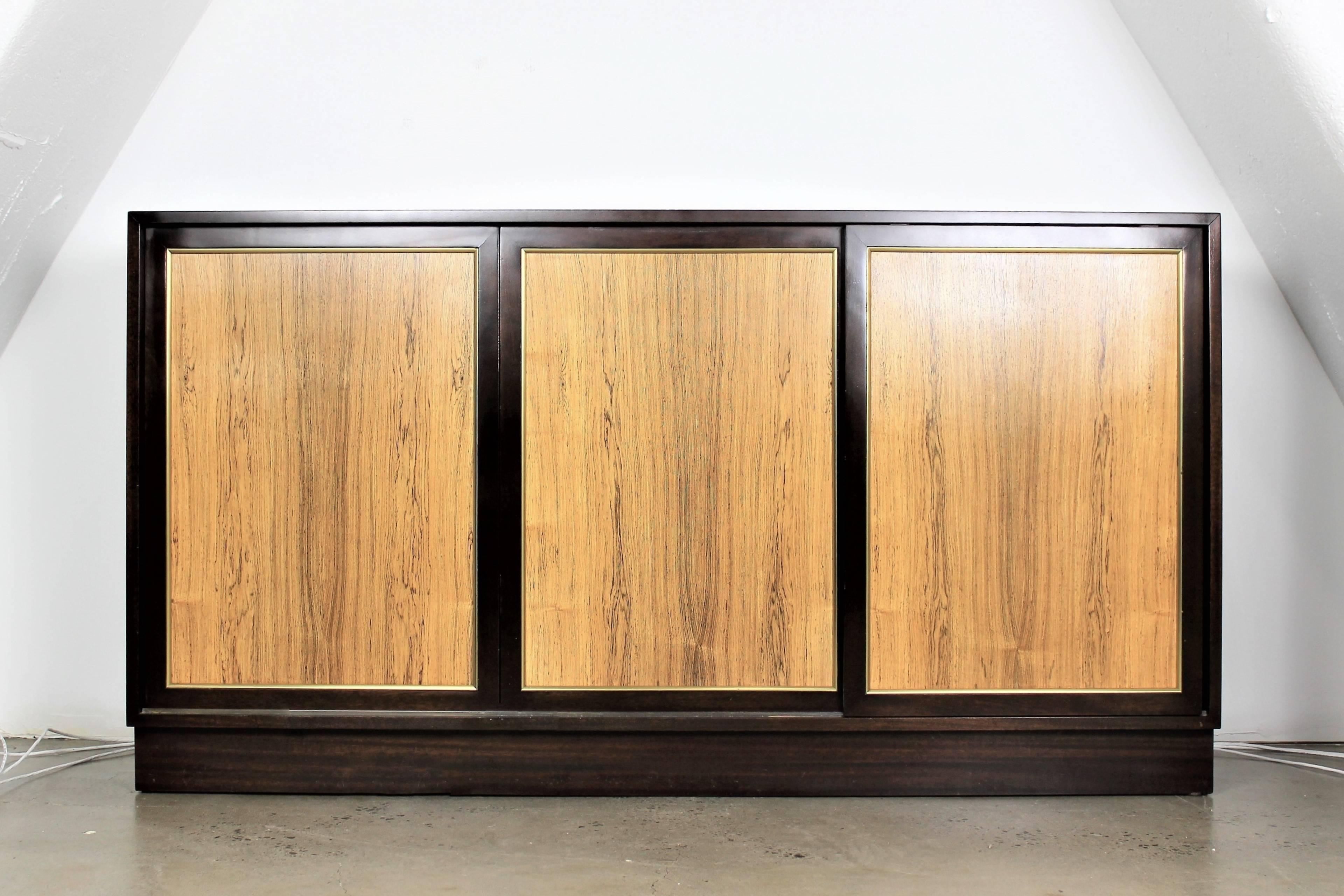Dresser or Buffet by Harvey Probber in dark mahogany with rosewood sliding doors, 1960s. Classic design and lots of storage. 
We had this piece fully restored when we purchased this estate (Hoboken, NJ mid-century estate of Probber pieces and