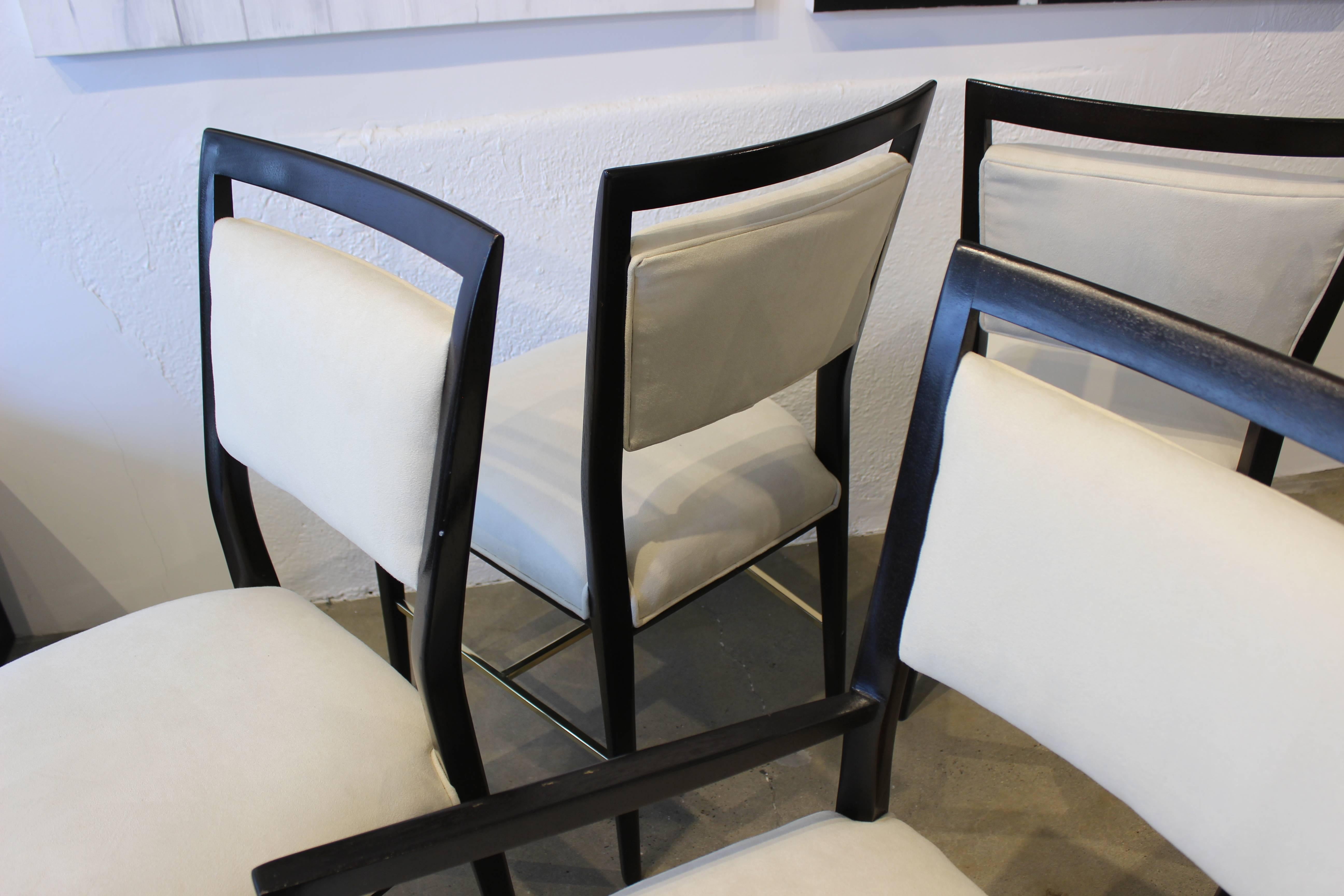 Paul McCobb dining chairs with brass stretchers. Newly refinished and reupholstered in a soft cream microsuede. 

Whether furnishing a contemporary Soho loft or stylish post-war Park Avenue penthouse, an artistic Central Park town home or your