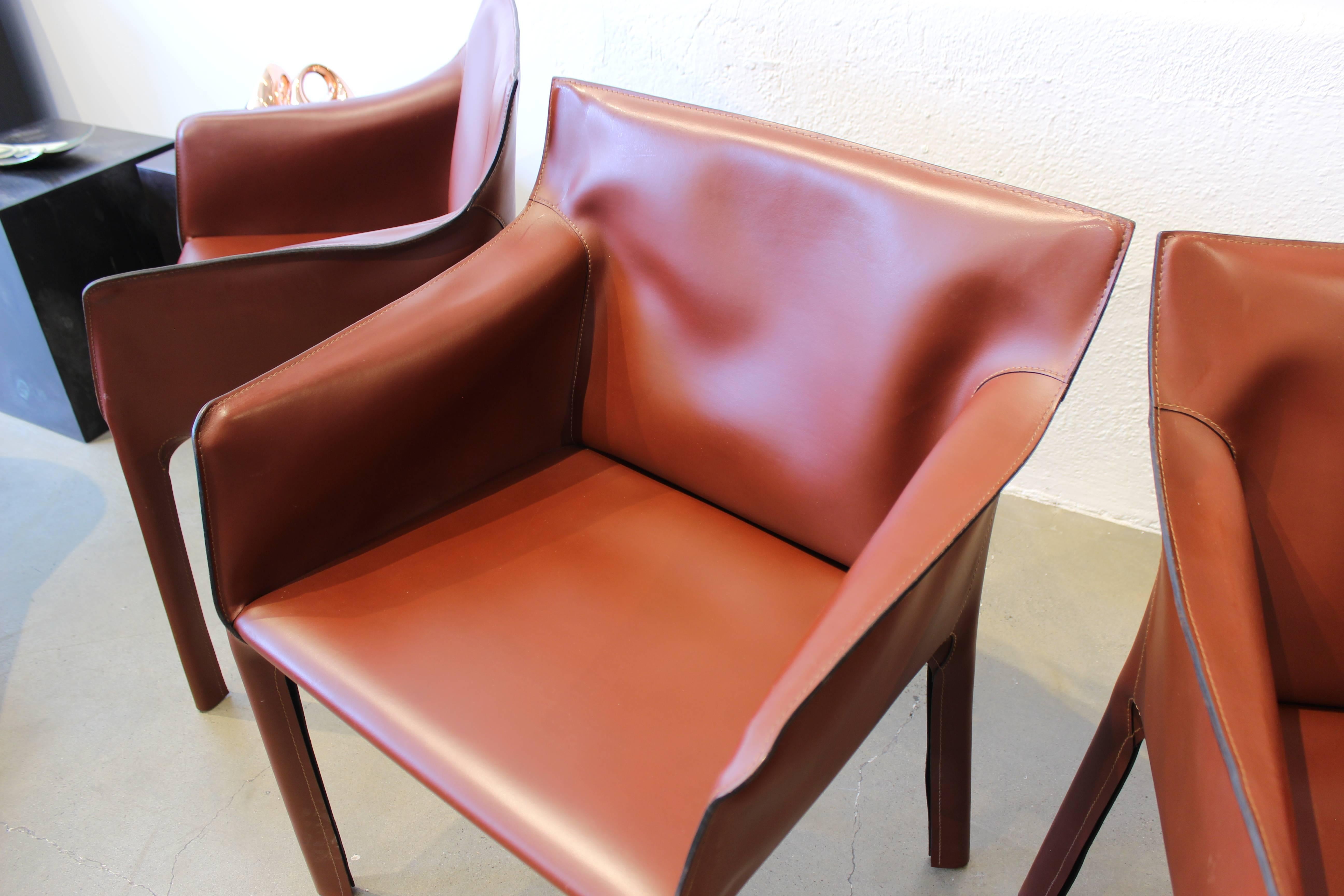 Gorgeous Russet Leather Armchairs by Matteo Grassi, Italy. Incredible quality and in excellent condition. Please inquire if interested in the full set of ten. Similar to the Cab chair by Mario Bellini for Cassina.

See this item in our private NYC