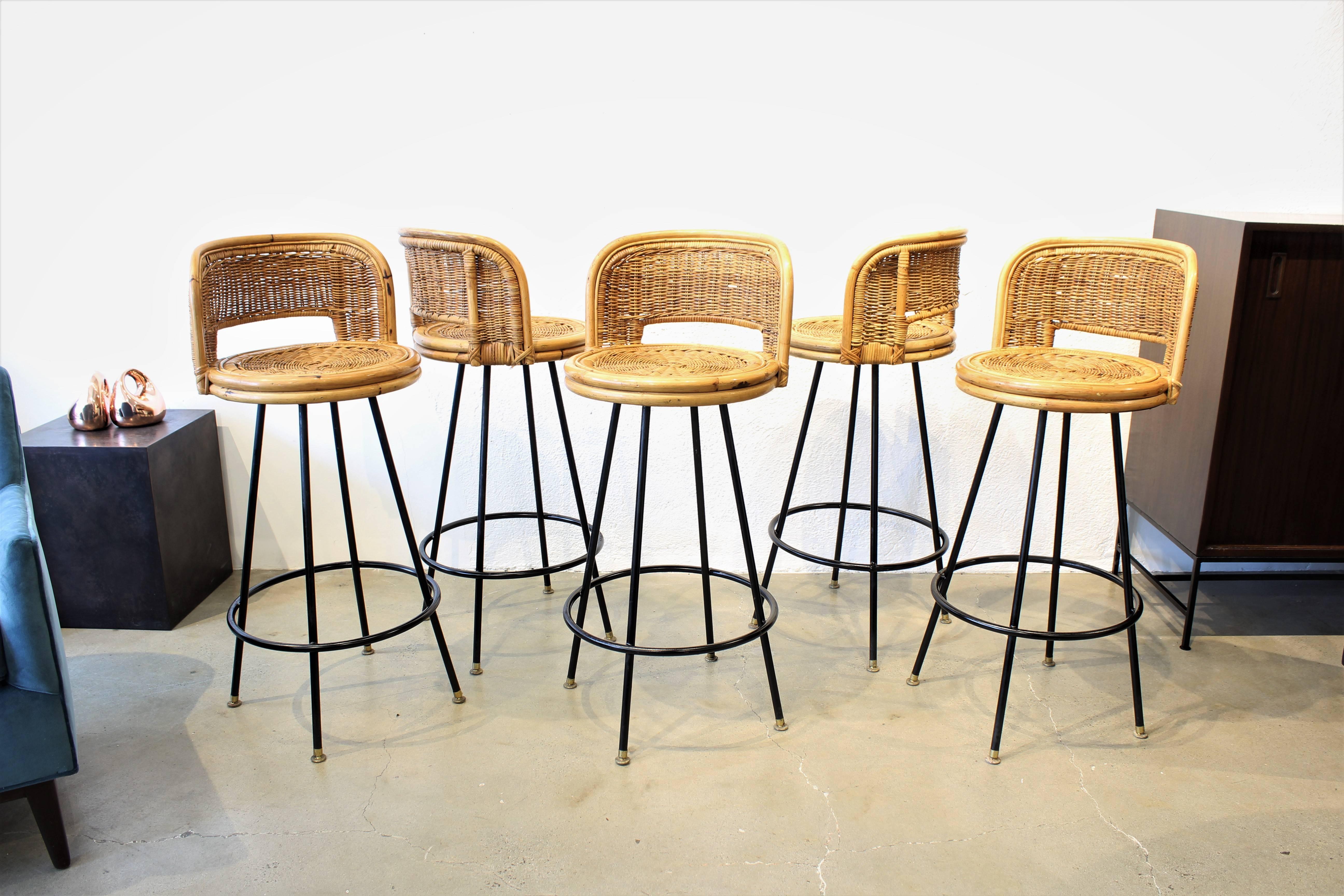 Set of five Pristine Rattan and wrought iron bar stools by Seng of Chicago, 1960s. This are amazing and just in time for your palm springs summer tiki bar! Awesome vintage condition with very little wear to the seats.

Refine Limited is a curated