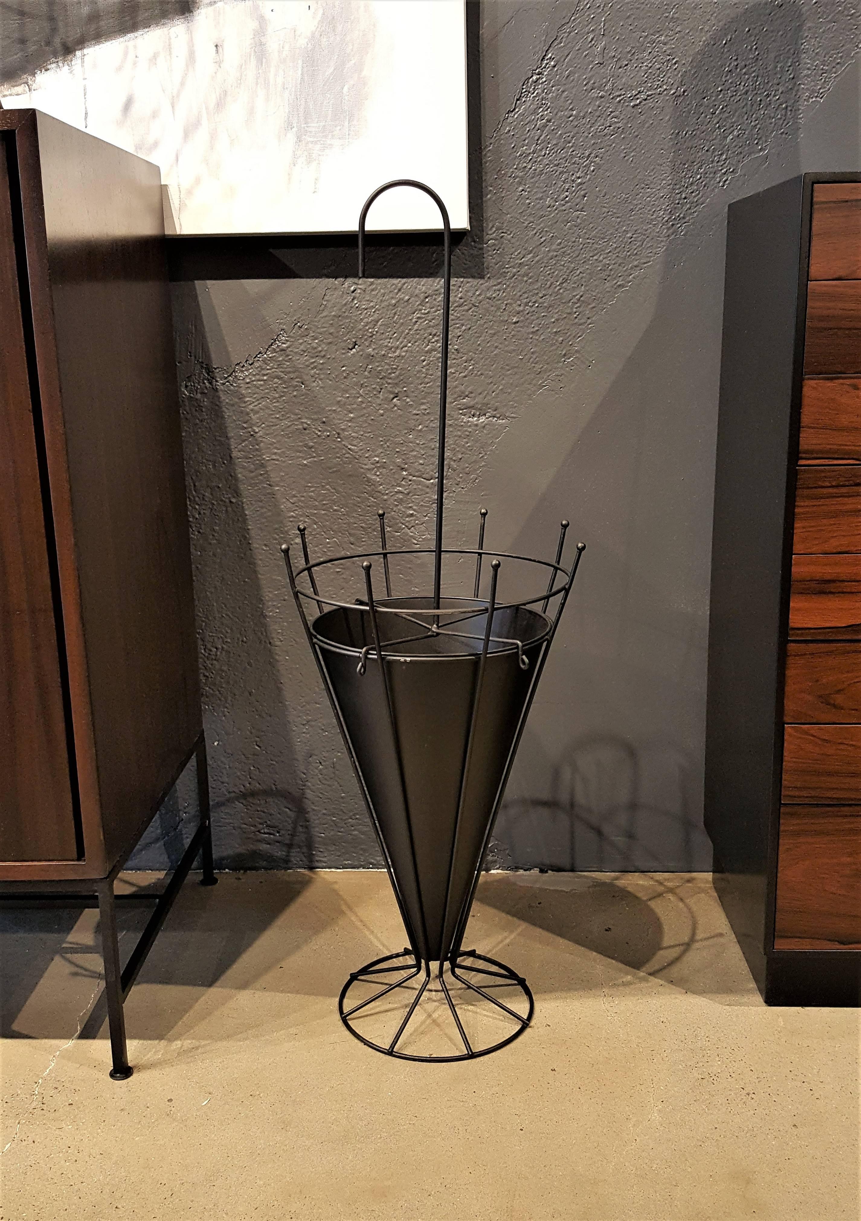 French umbrella stand in the manner of Mathieu-Matégot, 1950s. Painted metal. Excellent condition.

Whether furnishing a contemporary Soho loft or stylish post-war Park Avenue penthouse, an artistic Central Park townhome or your eccentric Brooklyn