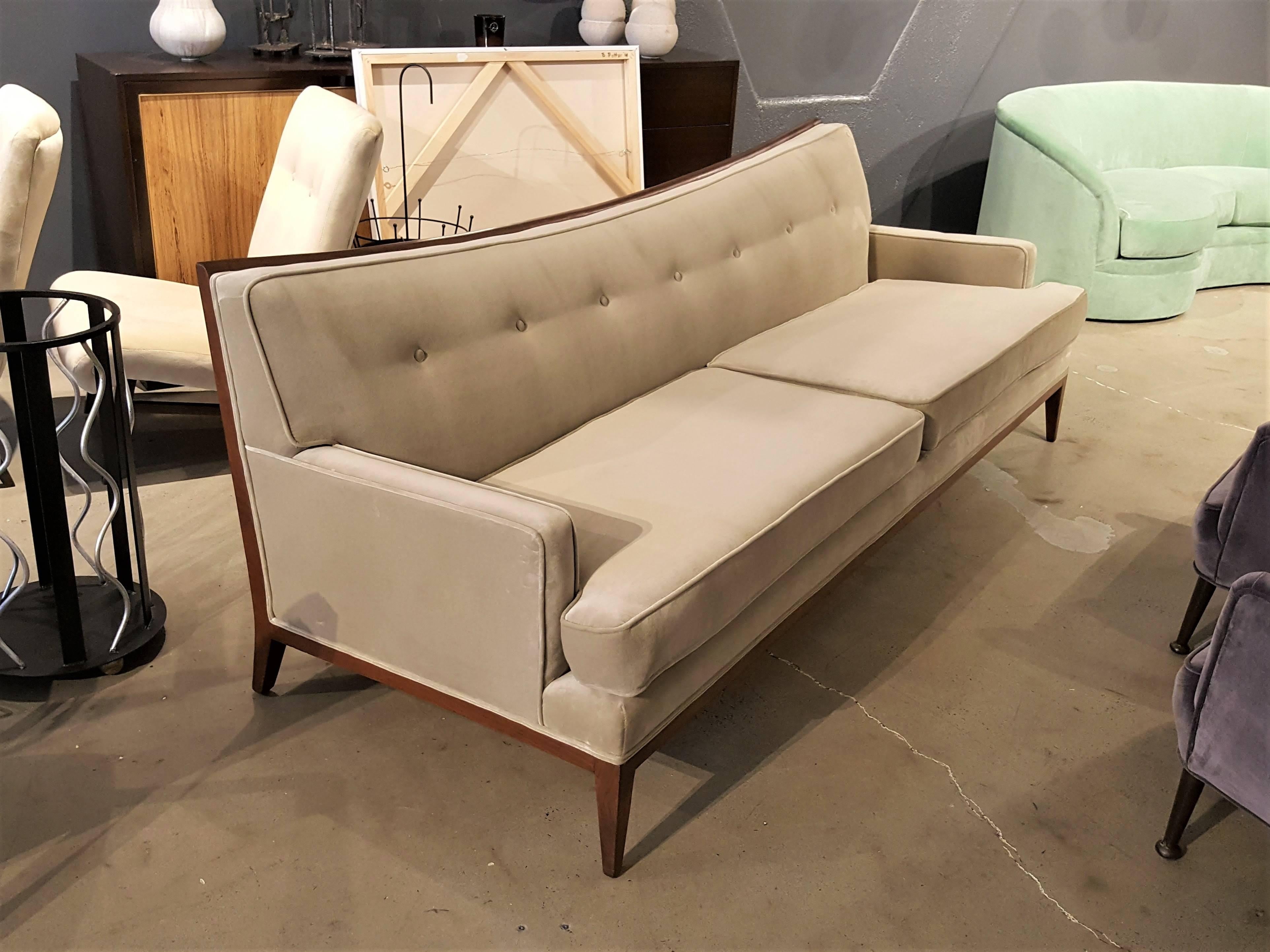 Gorgeous sway nack sofa with exposed mahogany frame attributed to Paul McCobb. Very well made, sturdy, and comfortable. Fully restored in a soft grey velvet.

Refine Limited is a curated collection of Mid-Century, deco, Danish modern, and decorative