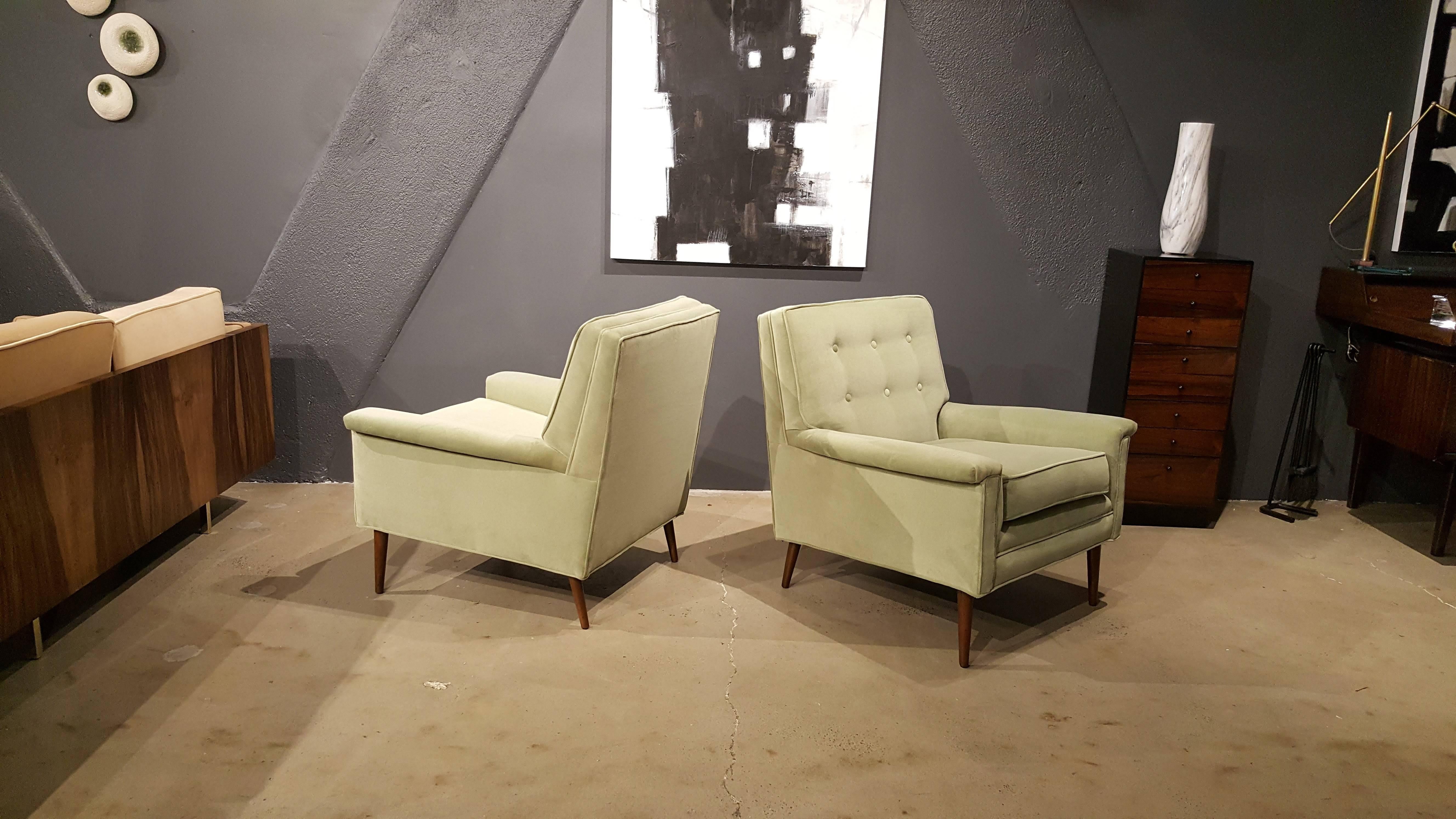 Pair of stately Mid-Century Modern lounge chairs attributed to Paul McCobb, early 1960s. Upholstered in lovely, soft Paris Green cotton velvet with turned walnut legs. Very comfortable, sturdy and well made with classic lines that work well in
