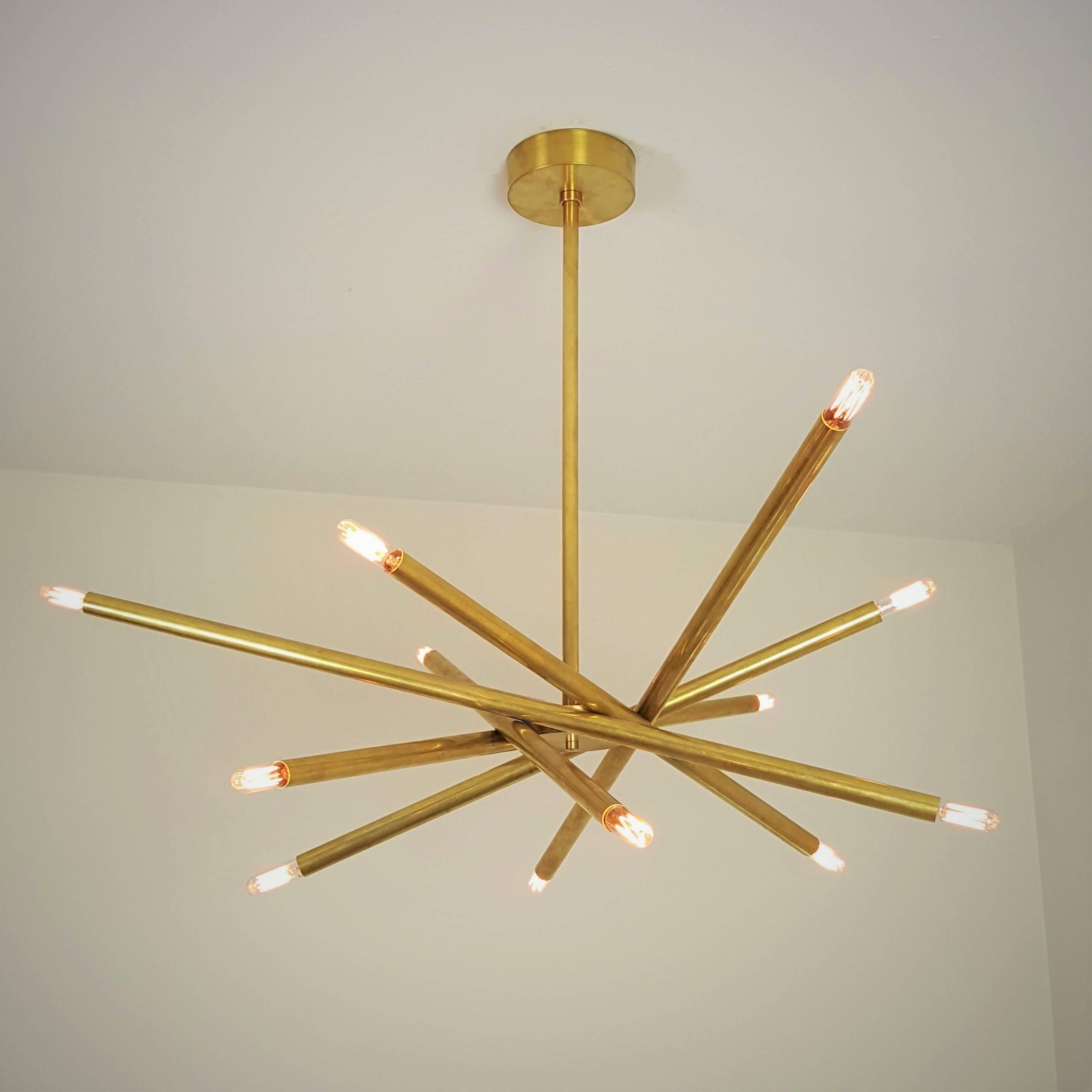 NEST: a sculptural brass chandelier , handmade in NYC by Blueprint Lighting. Striking design scaled to work well over a dining table, in a foyer, bedroom, or in a dramatic powder room. Particularly impactful in groupings over a bar or in a home