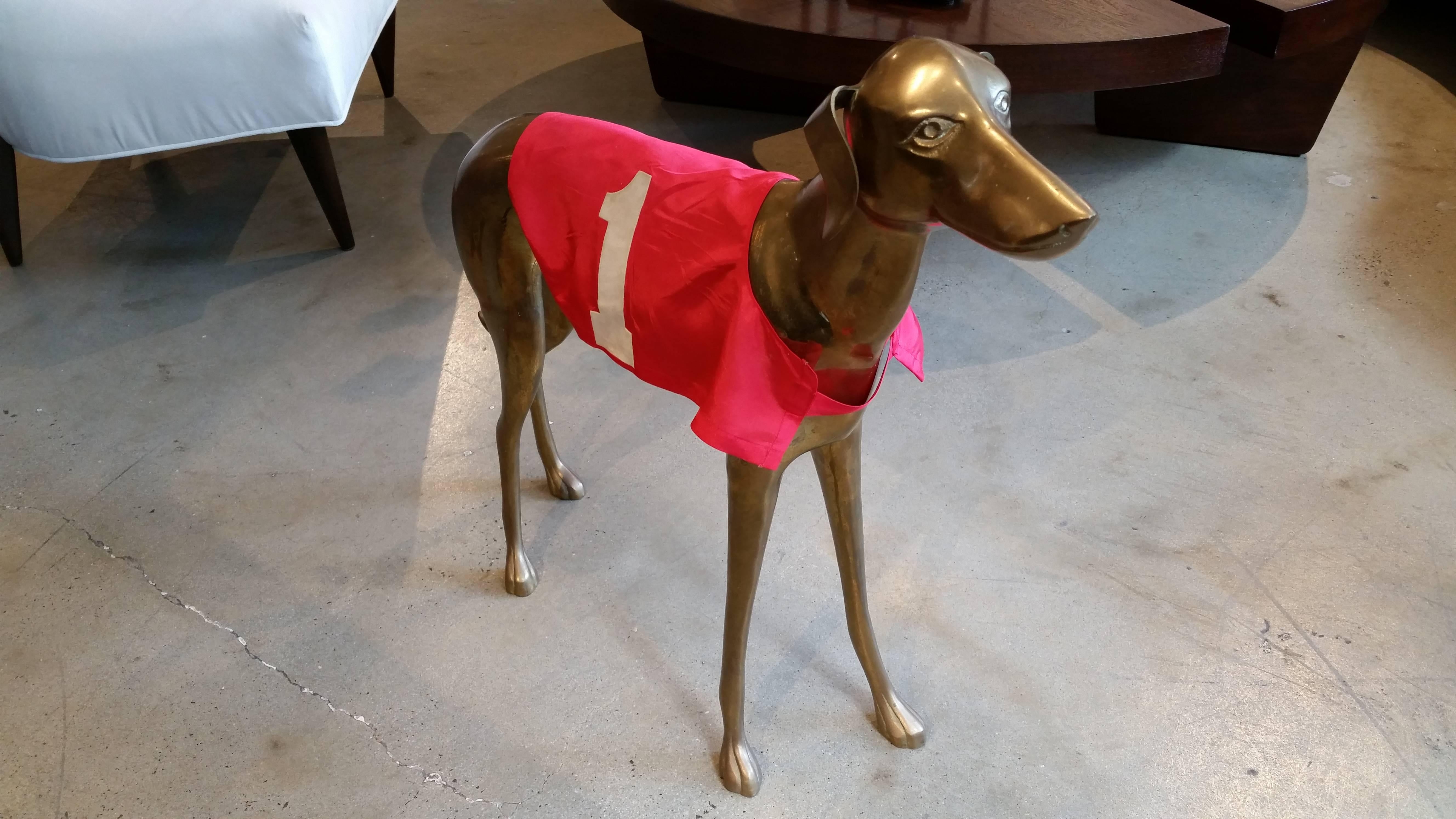 Commanding vintage Italian midcentury greyhound or whippet sculpture with original red racing jacket, circa 1960s. Large-scale 27