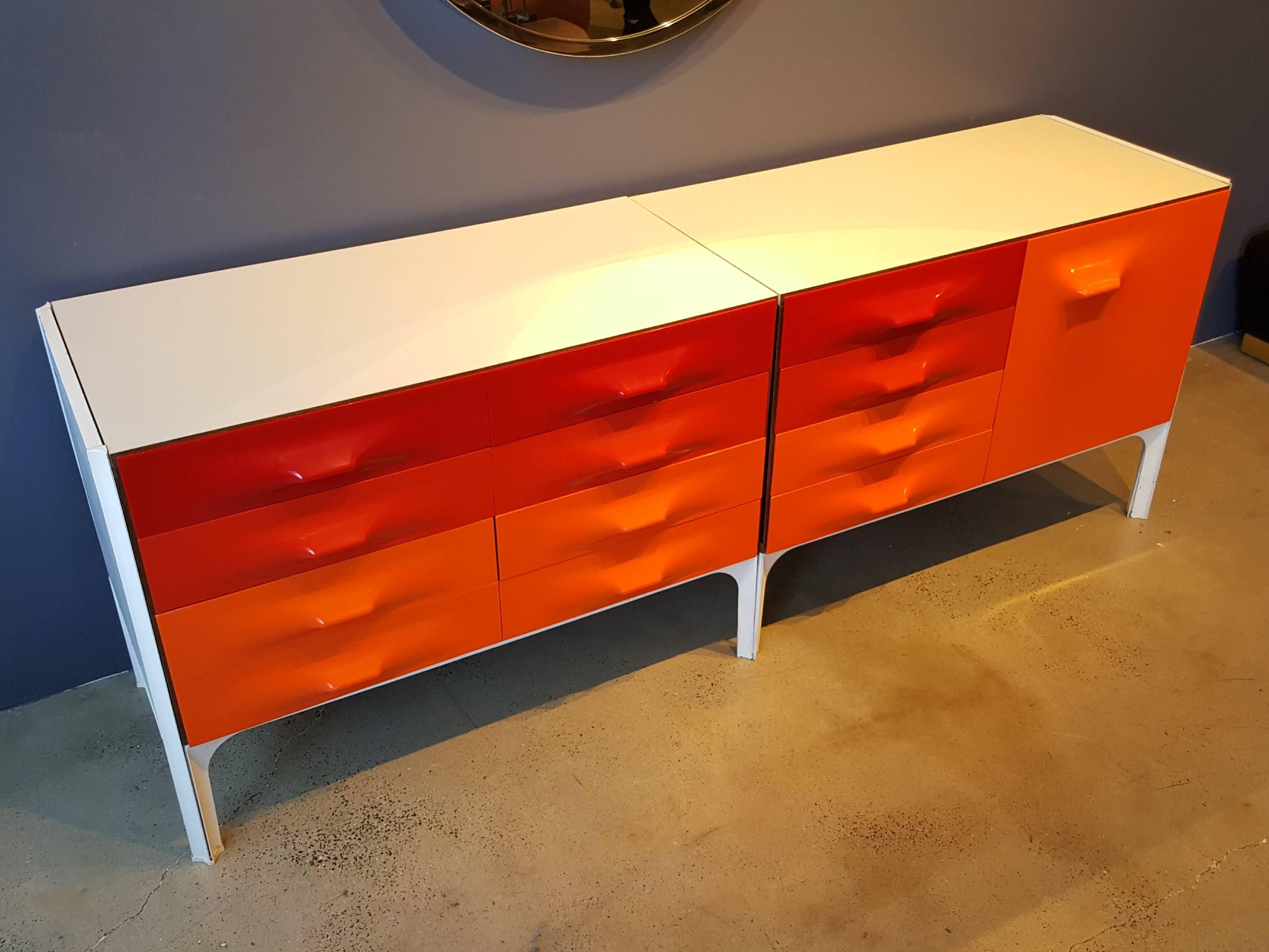 Very rare Raymond Loewy DF-2000 credenza for Doubinsky Frères, France. Hard to find piece, impactful space age design. Red and orange panels are in excellent condition and quite vivid. White laminate on top is clean and without stains or losses.