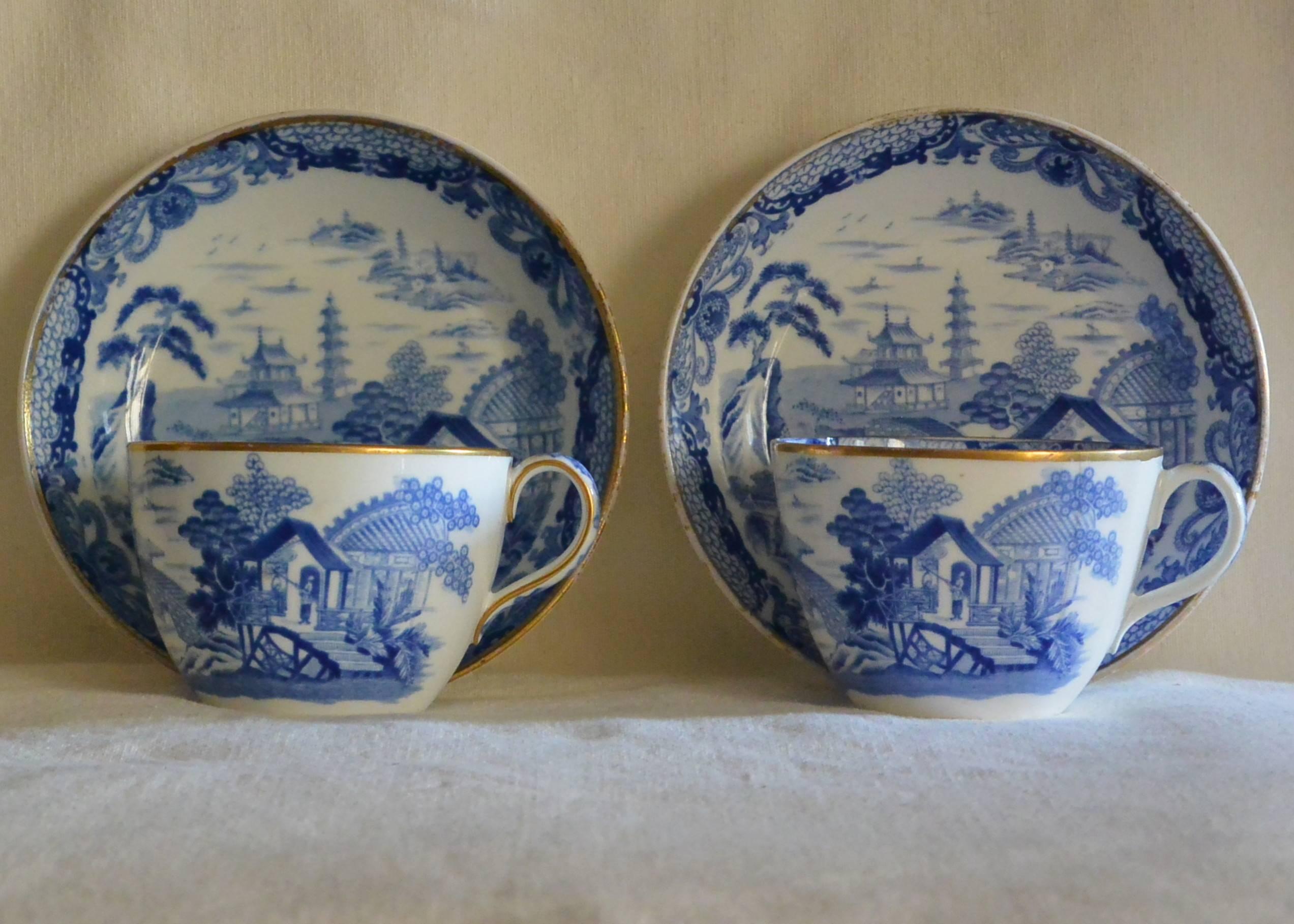 Pair of wedgwood blue and white oriental transferware cups and saucers with gold rims. England, circa 1812-1822.
Dimension: cup 3.5