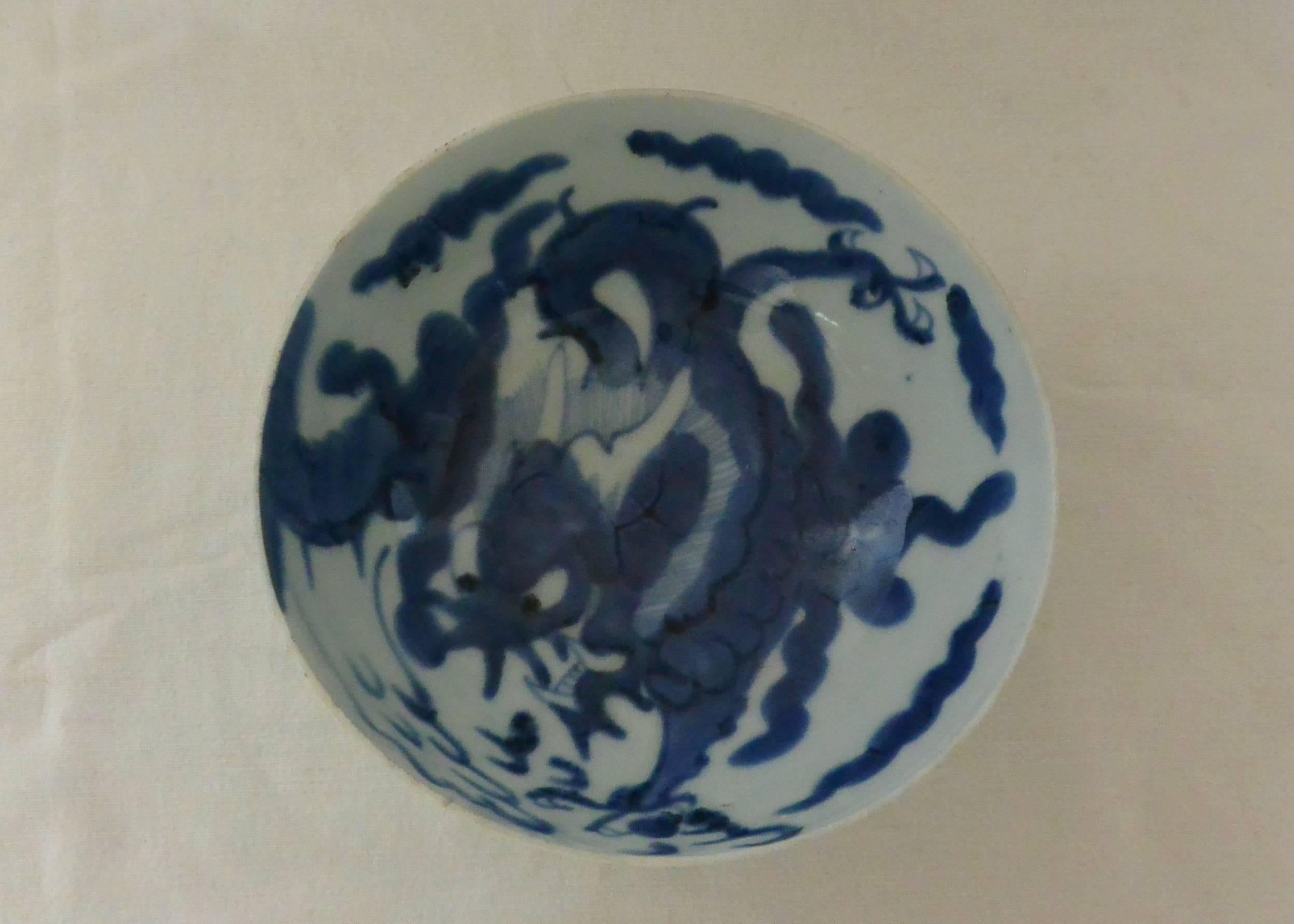 A dragon bowl in underglaze blue, modernist in conception. The exterior with one dragon amidst clouds rising from a medium foot ring. Kangxi period in mint condition, China, late 18th-early 19th century.  
Dimension: 7