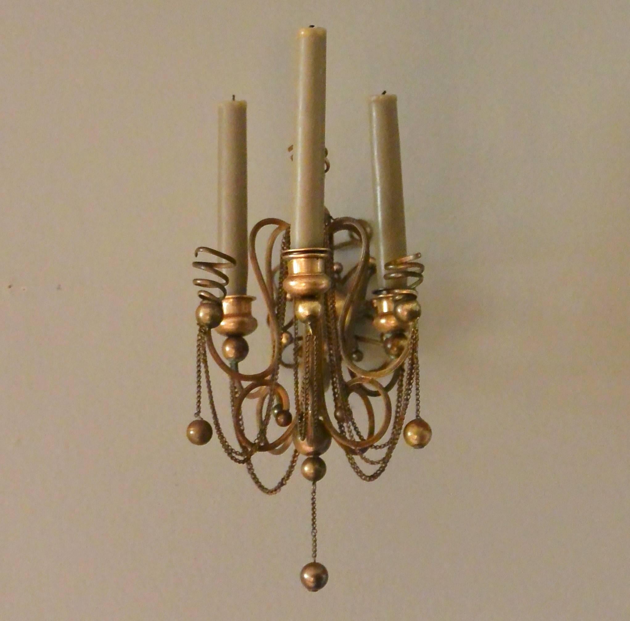 Continental brass ball and chain candle sconces.  Possibly Viennese three-light brass ball and chain sconces, Europe, circa 1880s.
Dimension: 6