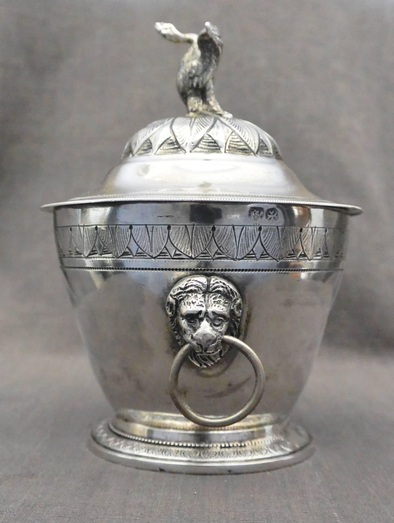 Silver Swan Sugar Bowl. Italian neoclassical sterling silver lidded sugar bowl with swan/goose finial and lion head ring handles. Italian sterling hallmarks. Italy, early 19th century.
Dimension: 3.75