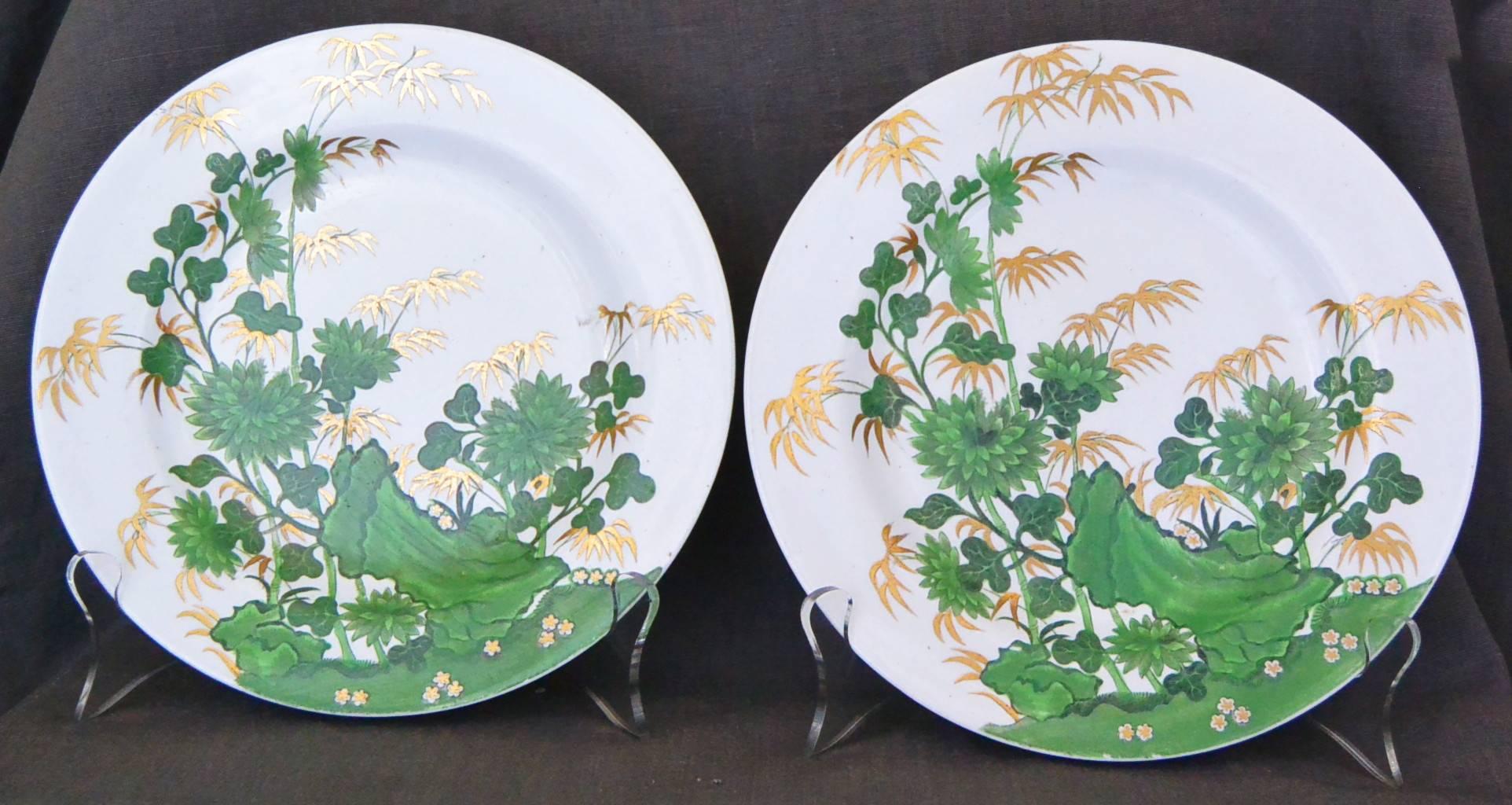 Eight Spode plates in the bamboo and rock pattern #1653; printed in black and painted in translucent green with gilding, England, circa 1810-8120. 
Diameter: 8.5