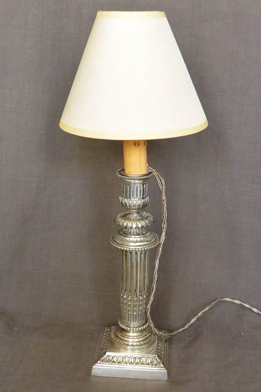 Fine silver plated French neoclassical style candlestick newly electrified with silver silk cord. Lampshade not included. Stamped Cailar Bayard Co., absorbed by Christofle in 1912. France, early 20th century. 
Dimension: 15